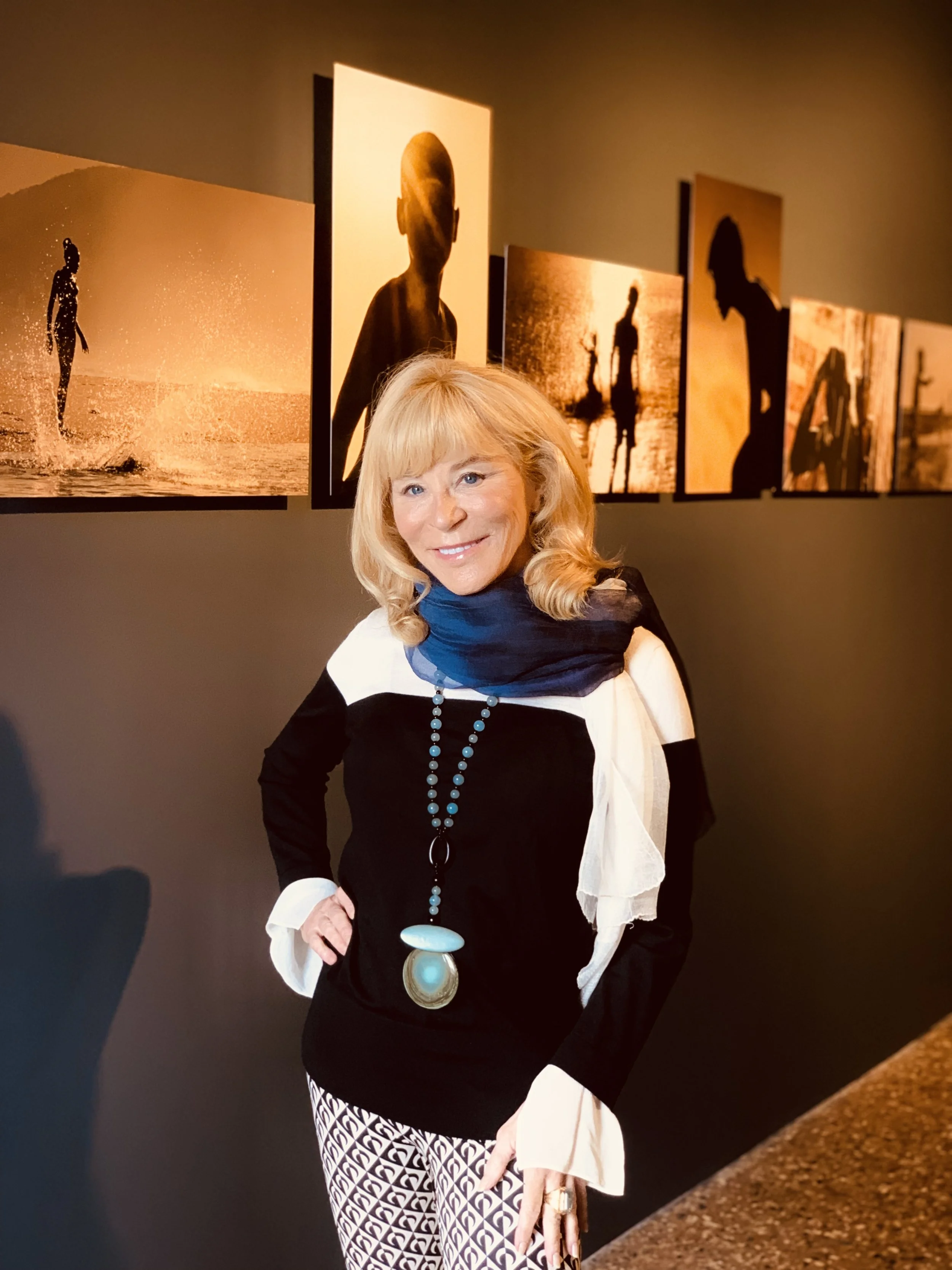 Sandra Cattaneo Adorno in front of her exhibition photos in Venice biennale