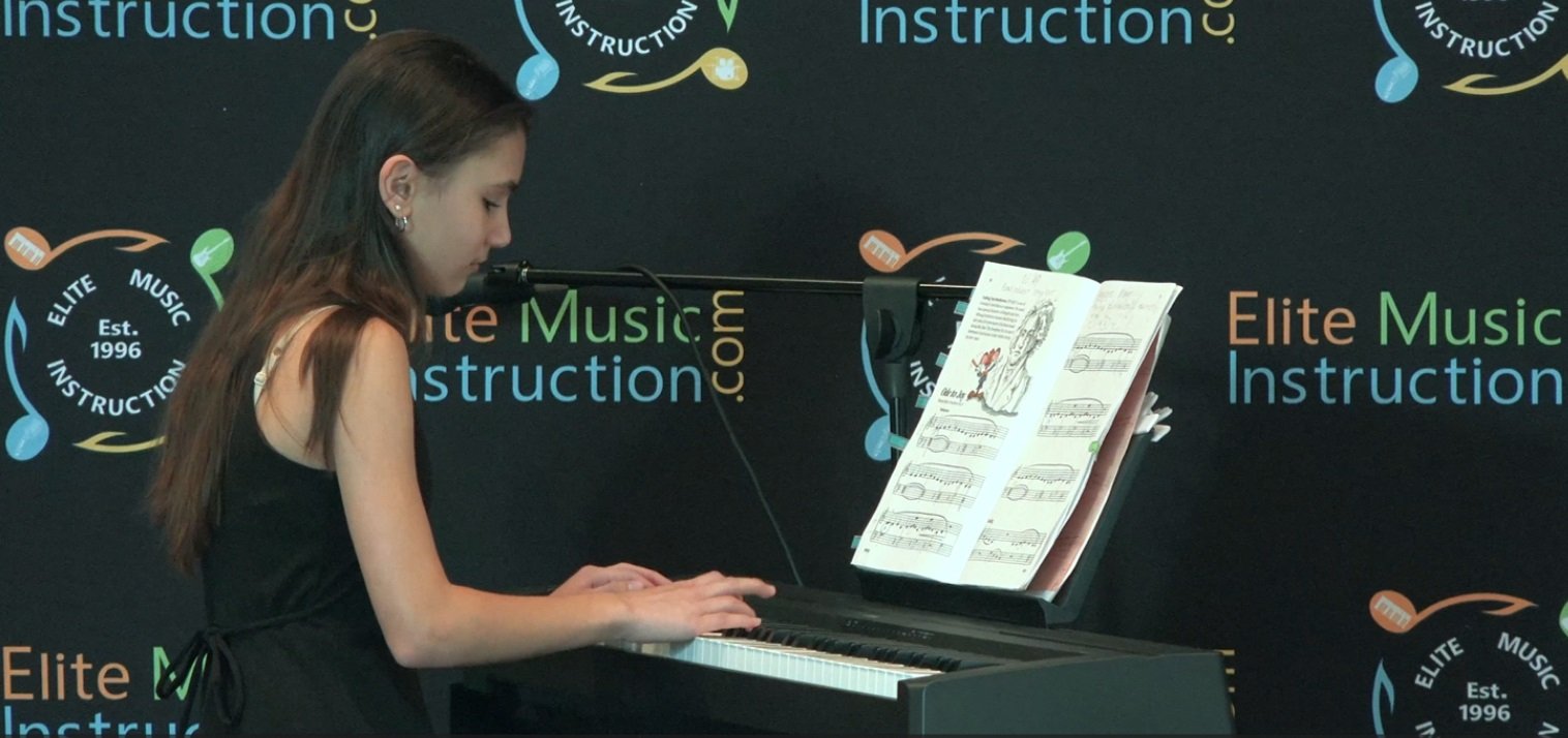 Piano student taking piano lessons in Plantation florida