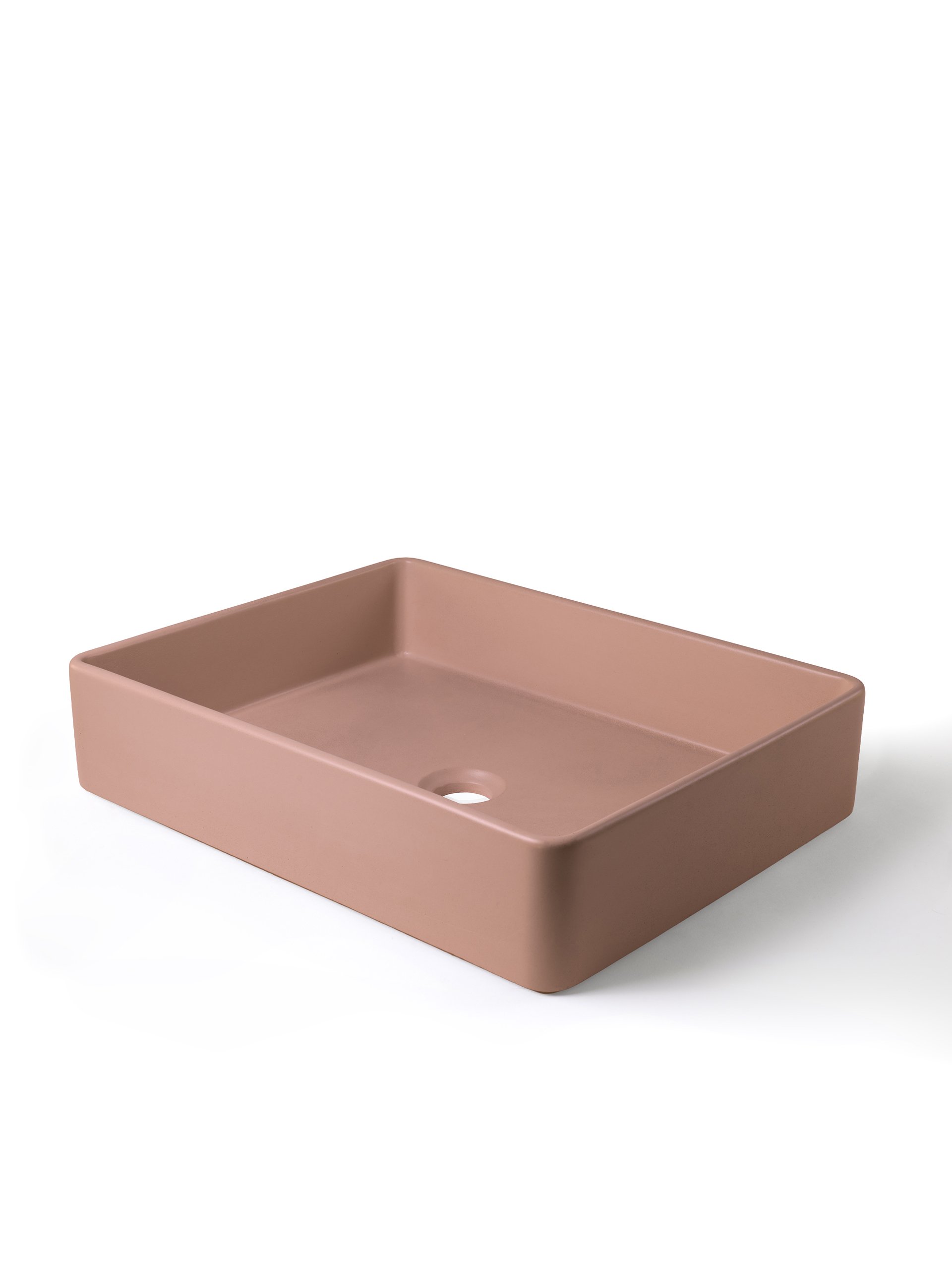 Angled view of rectangular concrete vessel sink in Sonora