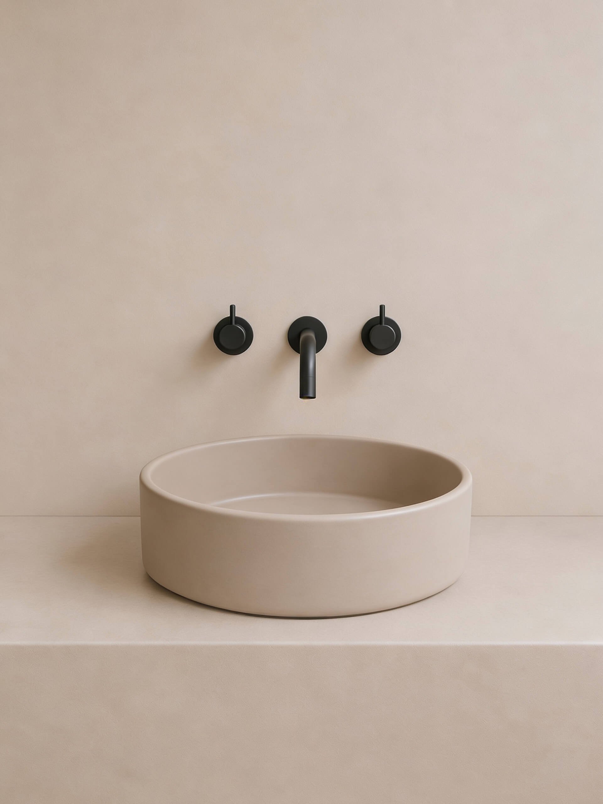 Dune round concrete vessel sink on tonal backdrop
