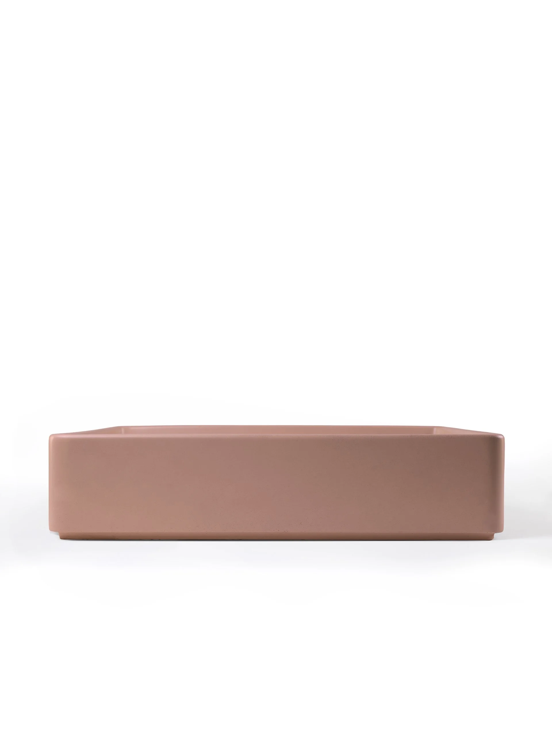 Side view of rectangular concrete vessel sink in Sonora
