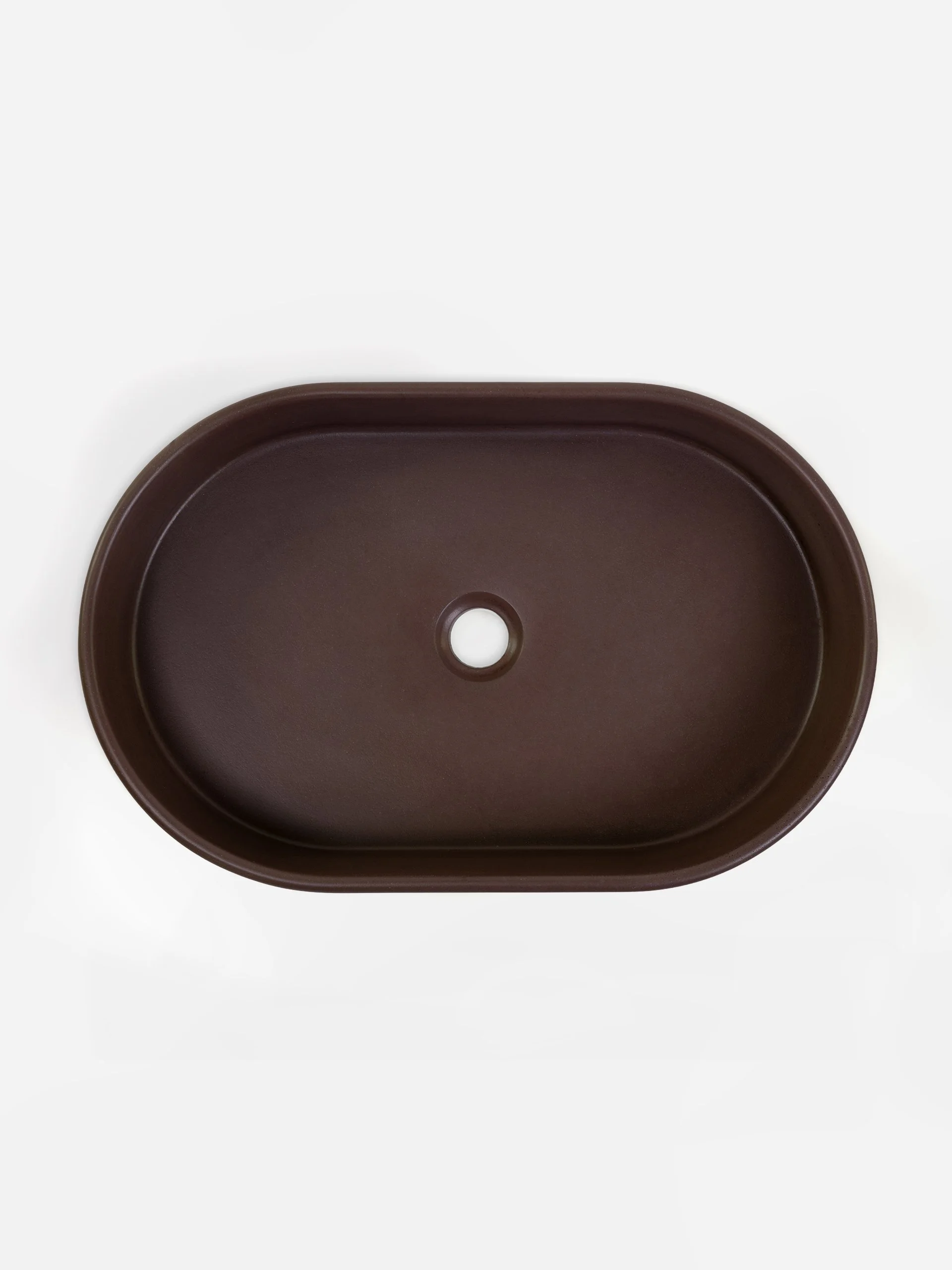 Top view of oval concrete vessel sink in Cimarron