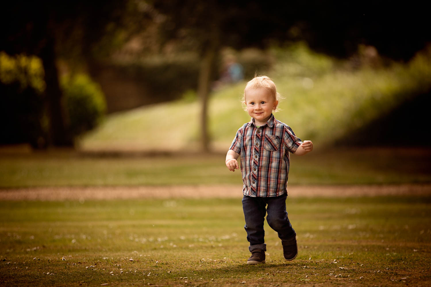  Toddler running during child photography session at Castle Ashby, Northampton. 