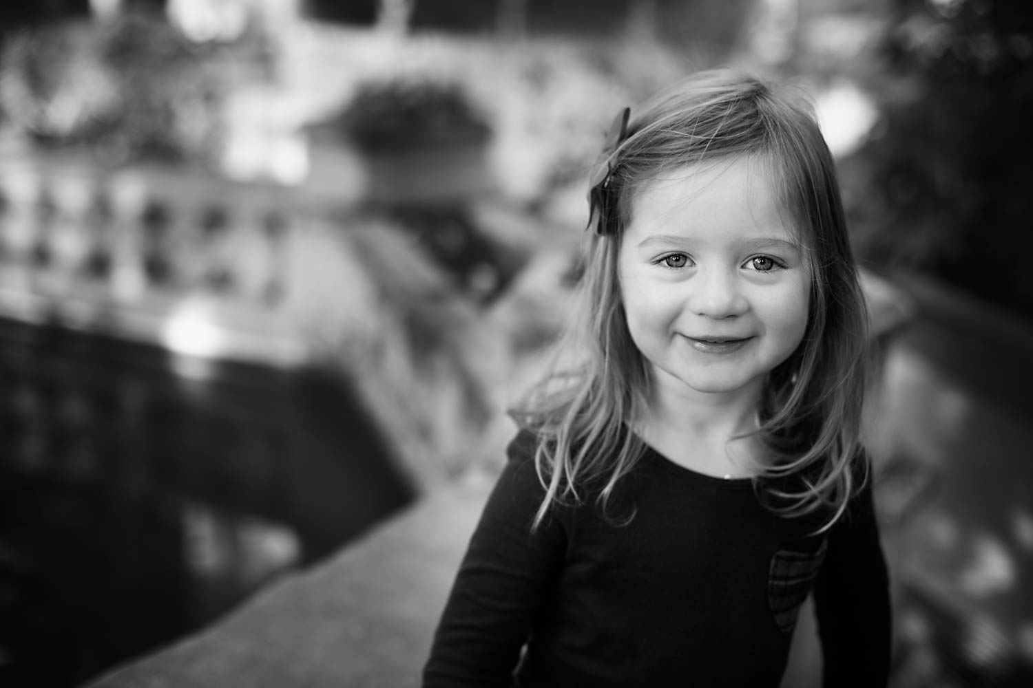  Young girl smiling in photoshoot in the orangery at Castle Ashby 