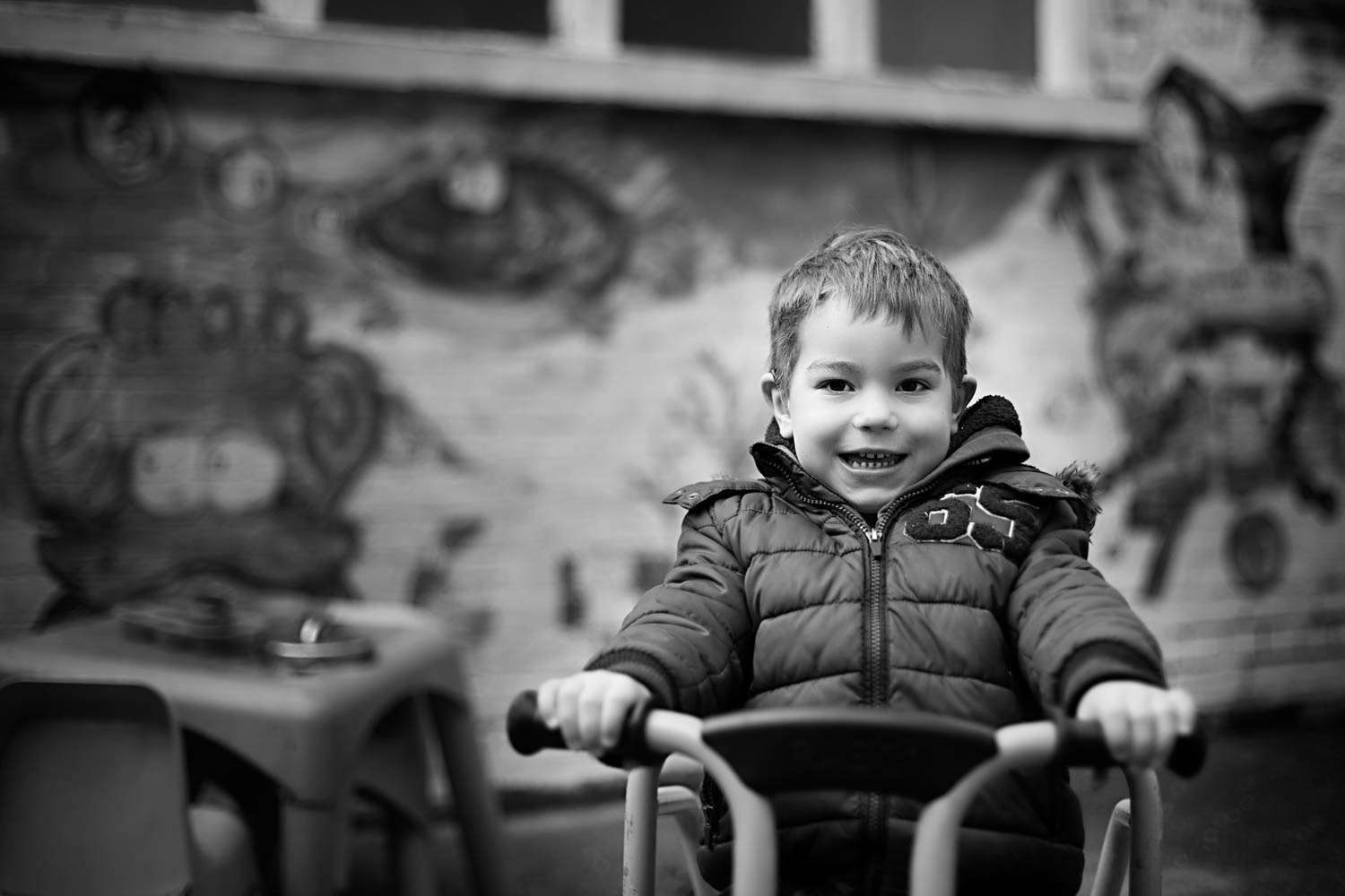  Boy on bike, posing for a portrait during a preschool photoshoot in Turvey Bedfordshire. 