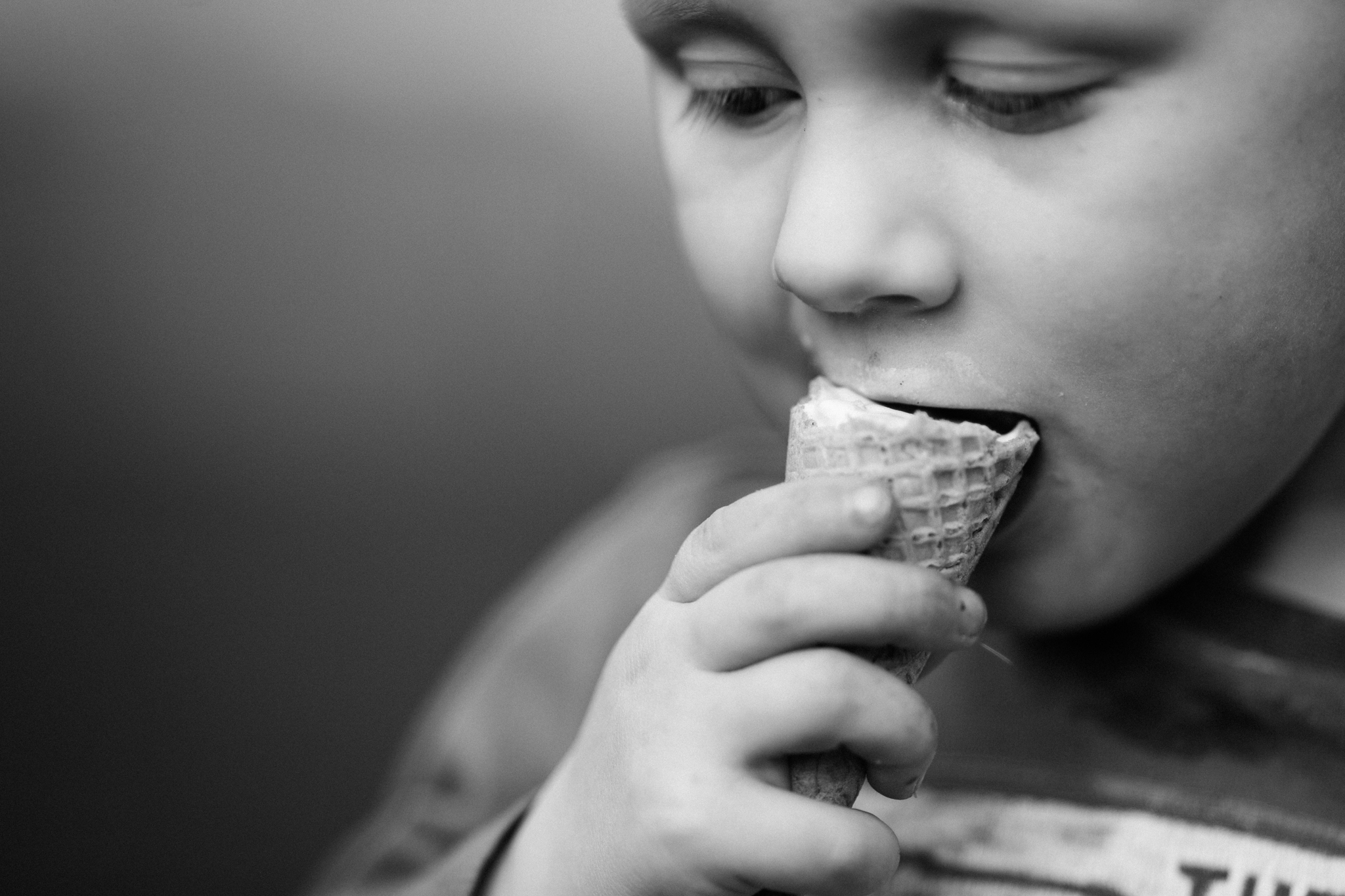  Child eating ice cream during spring photoshoot in Olney, Buckinghamshire   