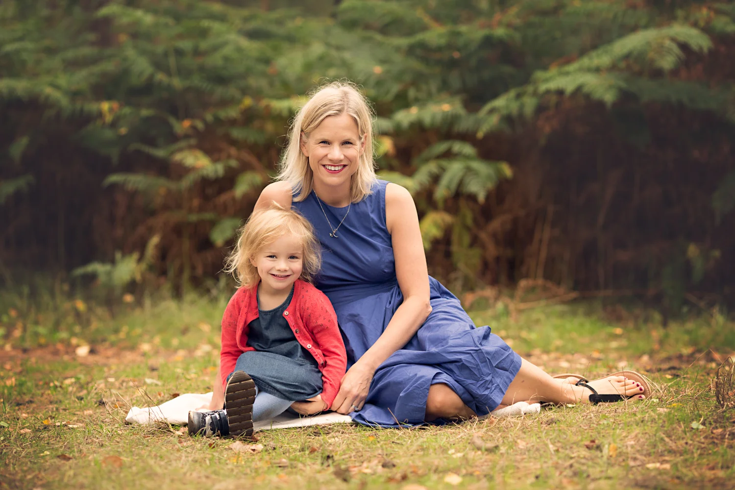 Mother and daughter pose for a photo during a Family Photoshoot in Aspley Heath Woods, Bedfordshire
