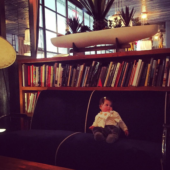 Karina taking a moment to digest her food in the Maritime hotel lobby.