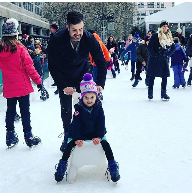 Daddy and Daughter put in some ice time #batterypark. First time? Don't worry, rent one of the ice sleds to make sure you spend more time gliding and less time on your bum on the ice. #icebaby #heyjetsetbaby #iceprincess @bfplny