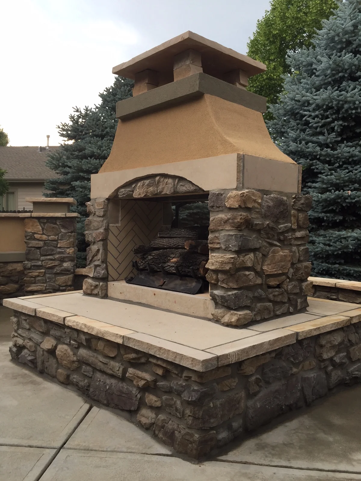 Custom water features, outdoor fireplaces, and outdoor fireplaces
