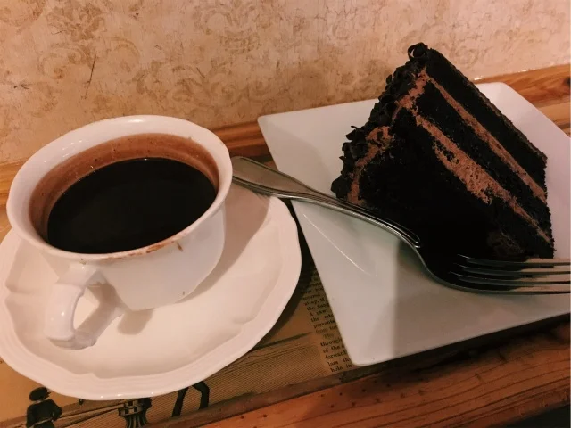THINKING CUP- FRENCH HOT CHOCOLATE AND A SLICE OF DARK CHOCOLATE CAKE