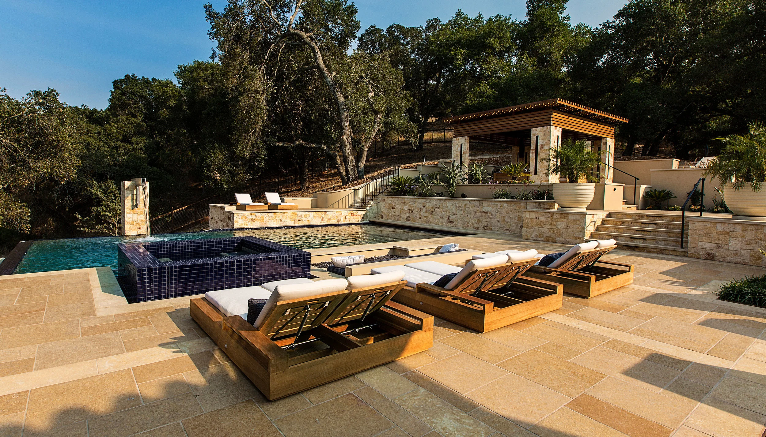  The design of this project combines traditional elements from the home style and a more contemporary finish to the new elements.&nbsp; We transformed the bare hillside left by the builder into the yard you see before you. 