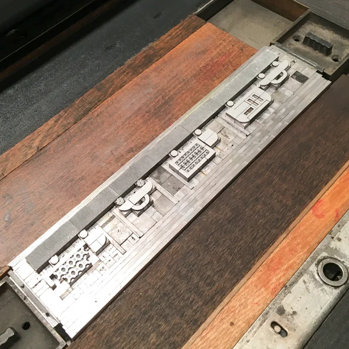 Metal type on press to print row of traffic