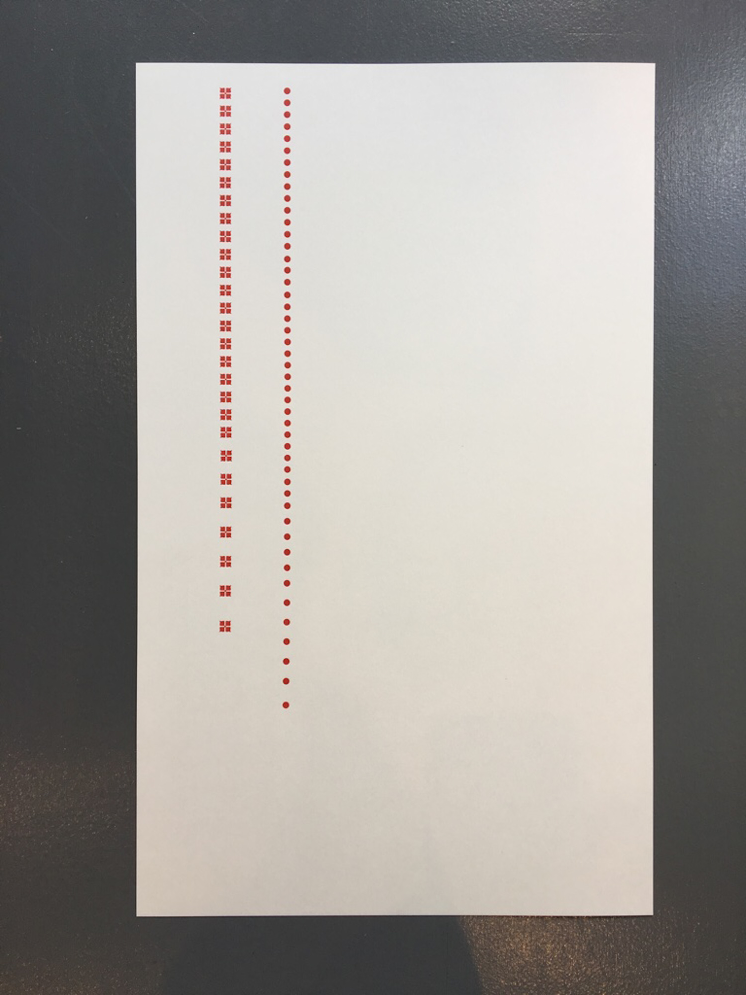 Letterpress print with red dots