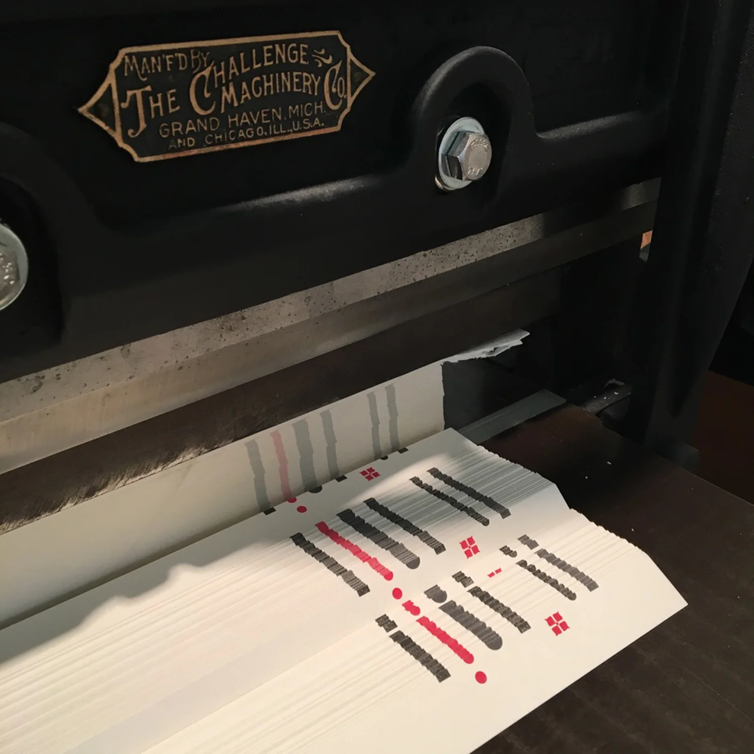 Trimming-prints-on-antique-paper-cutter-CH-2017.jpg