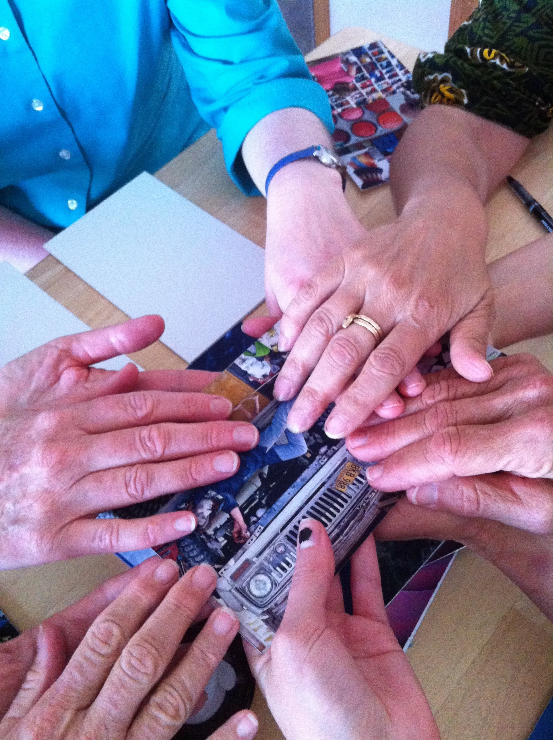 After the card speaks, the group holds hands with gratitude.