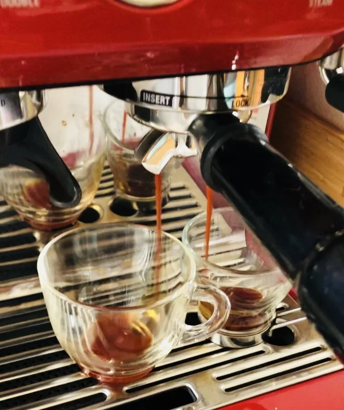 Tea espresso dripping out into the cups.