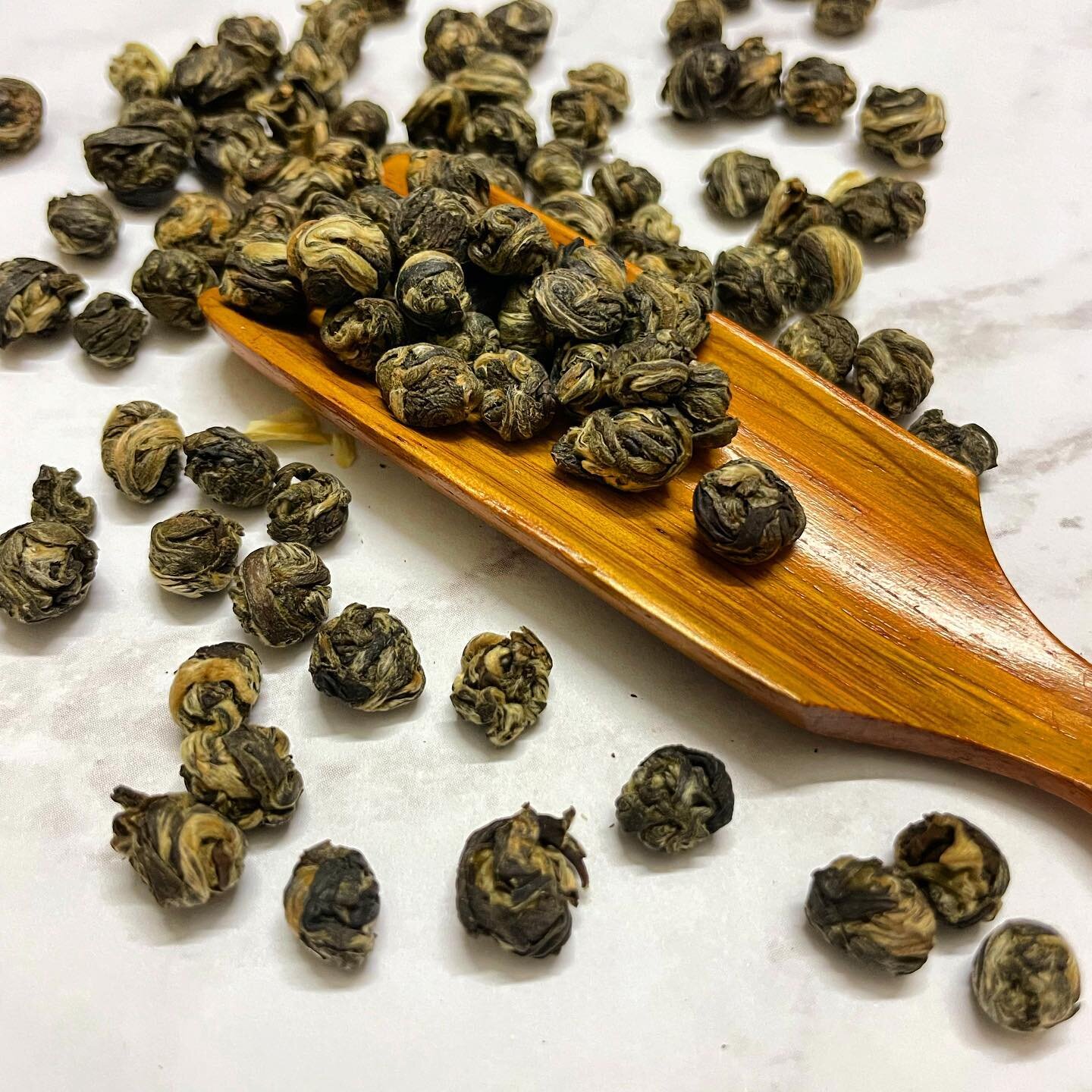 Jasmine Pearls green tea. 

#beantowntea #greentea #jasminetea #teapearls #foodphotography #tealeaves #chinesegreentea
