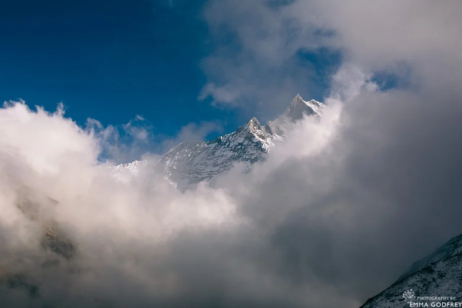 Machapuchare peeks through the clouds