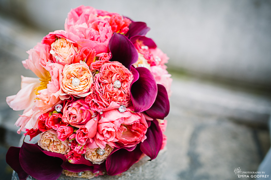 A bouquet of peonies and lilies in peaches and pinks