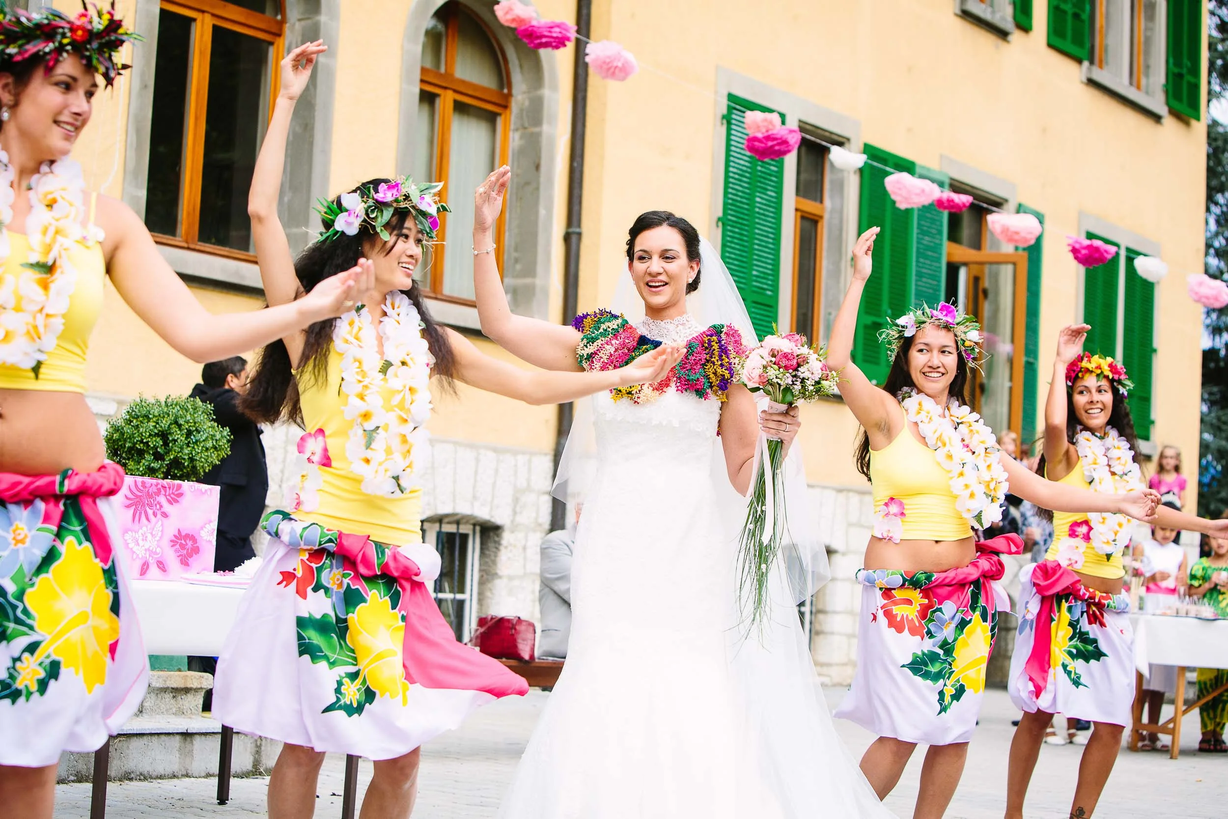 Bride dancing for groom with bridesmaids, traditional Tahitian dance.