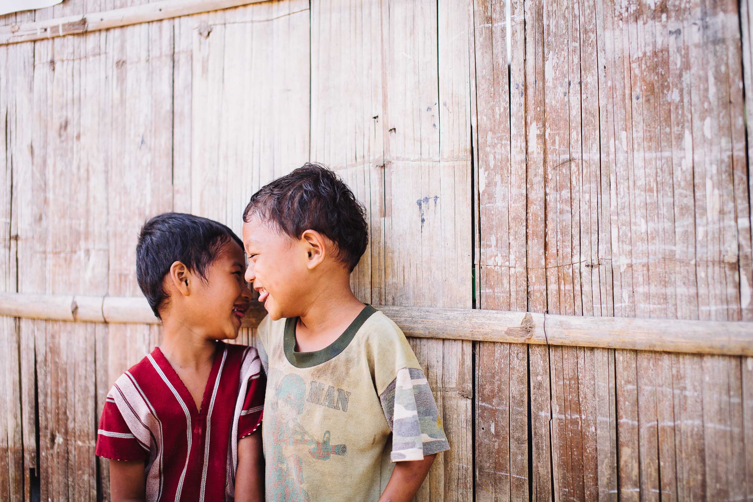 Two young boys laughing