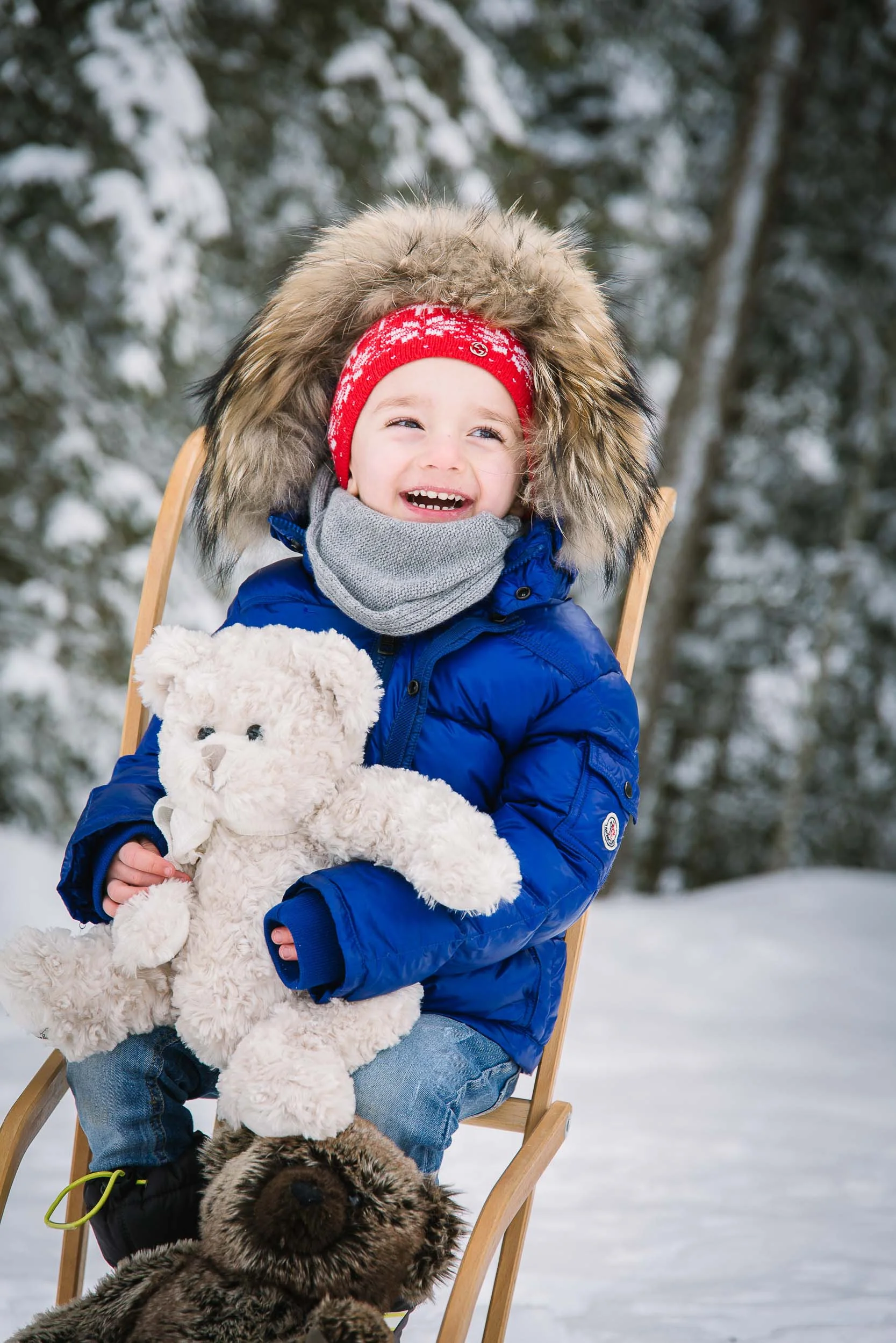 Props and toys make for a fun family shoot in the snow.