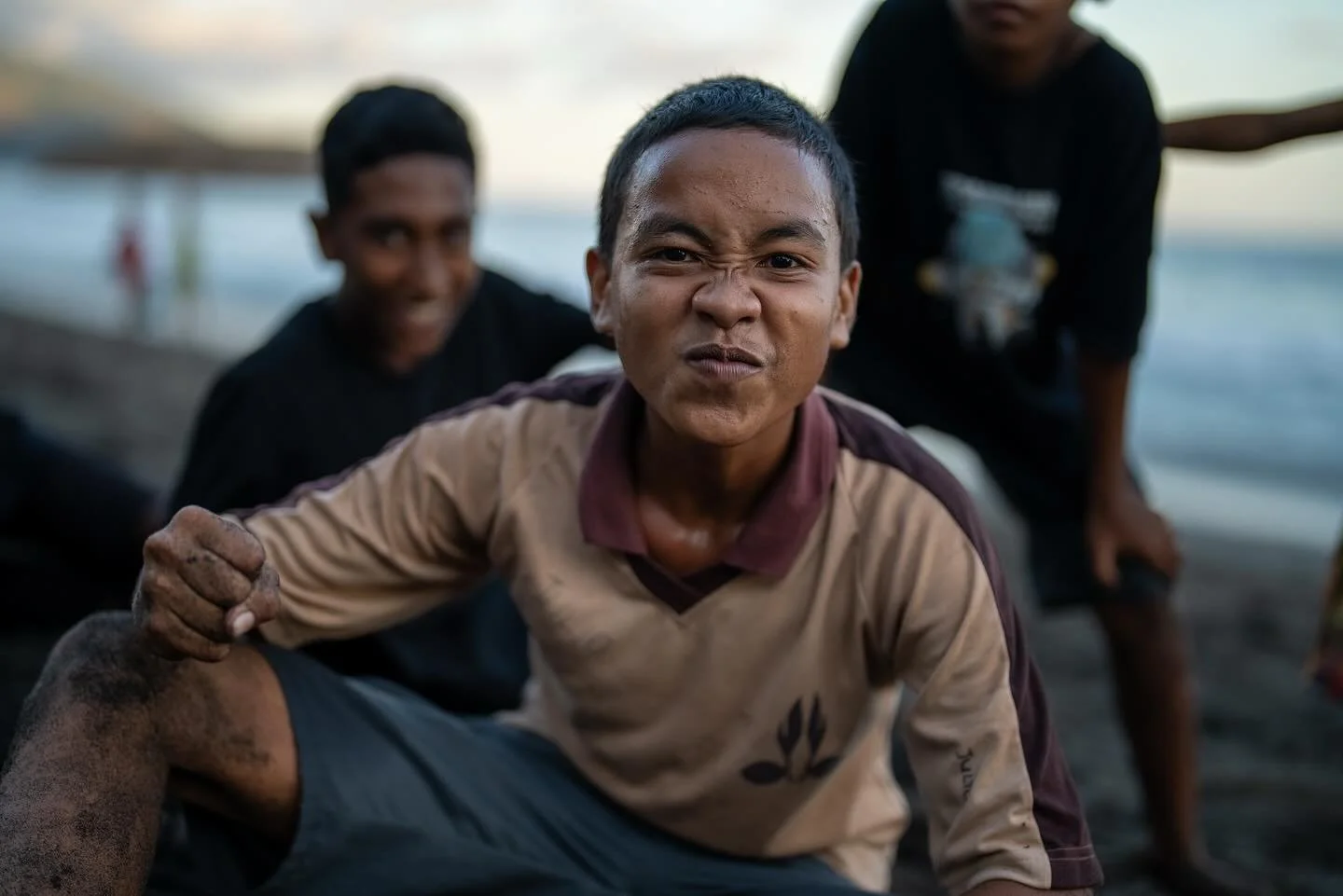 1. Boys pose on the beach in Ende, Flores
2. Boys drink homemade Arak out of a severed water bottle.