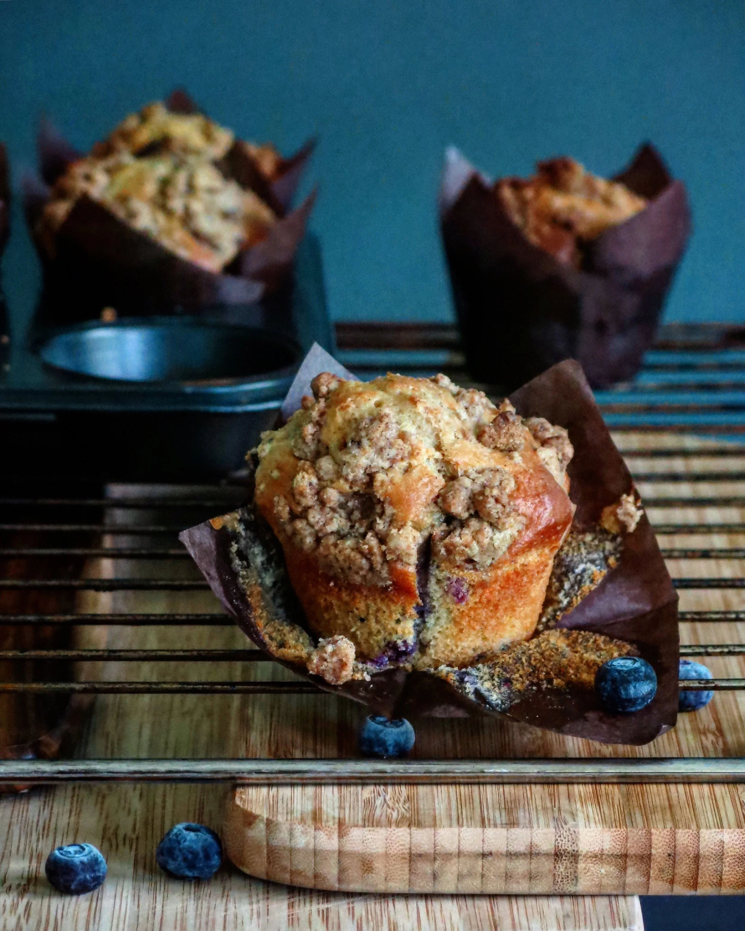 Ingredients 1 3/4 Cups Plain Flour 1/4tsp Salt 1tbsp Baking Powder 1tsp Lemon Zest 1 Egg 1/2 Cup Brown Sugar 1/2 Cup Plain Yoghurt 1/4 Cup Vegetable Oil 1/4 Cup Milk 1 1/2 Cups Blueberries Streusel Topping : 1/4tsp Cinnamon 1/4 Cup Flour 2tbsp Melted Butter 2tbsp Brown Sugar Method In a bowl combine the flour, salt, baking powder and lemon zest. In a separate bowl, mix together the egg, brown sugar, yoghurt and vegetable oil. Add the dry ingredients to the wet ingredients and gently combine. Add the milk and mix in. Fold in the blueberries until just coated. Make the streusel by combining the cinnamon, flour and sugar. Add the melted butter and mix until you get clumps of streusel. Line a muffin tin with baking paper or cupcake holders and fill each on 3/4 full. Top with the streusel and bake in a preheated oven at 200 degrees for 20 minutes.
