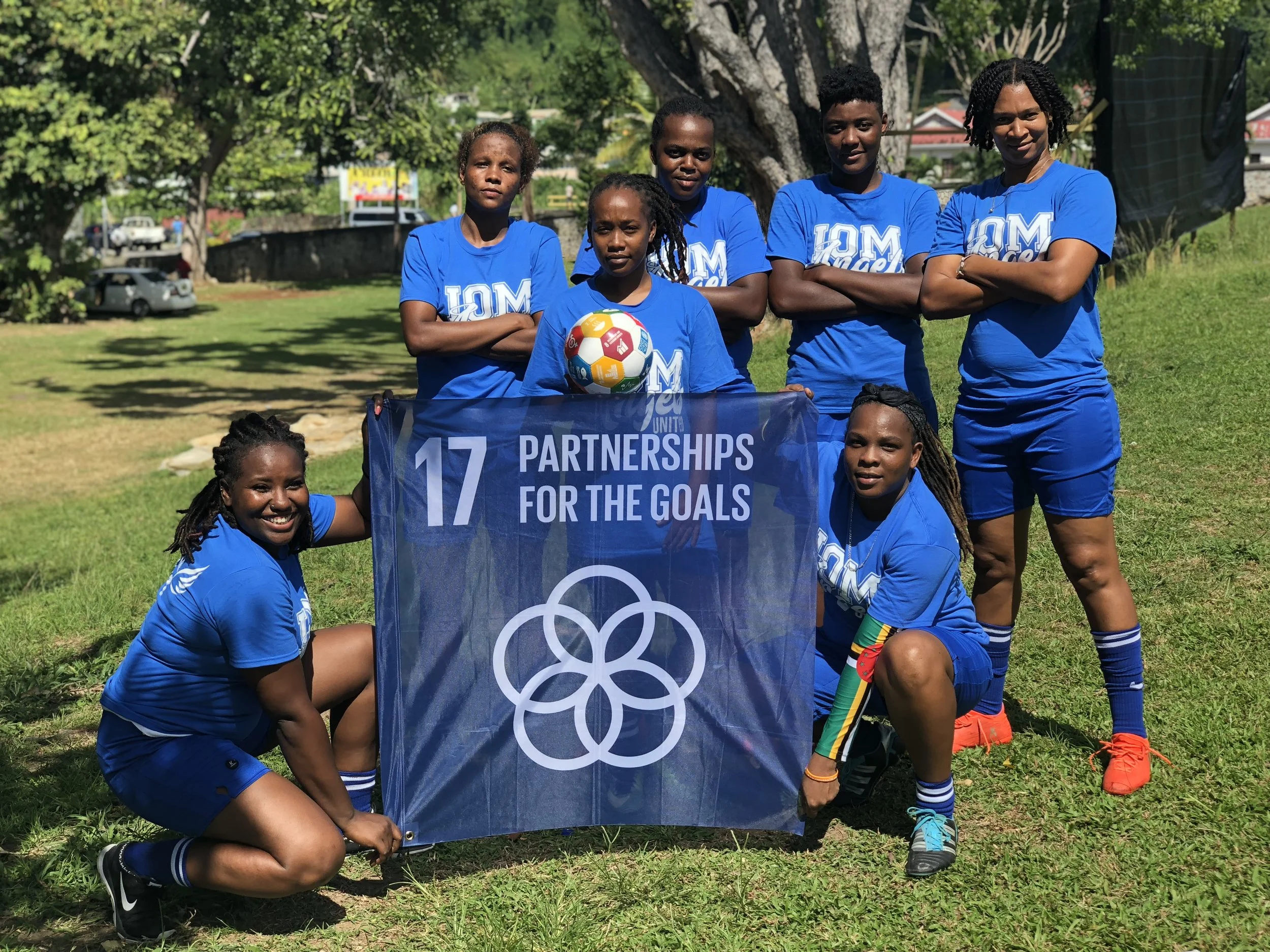 IOM Angels United - Goal 17 “The company that I work with IOM has partnered with several organizations and the Government of Dominica to facilitate the roof repairs and building of small core shelters for hundreds of local residents. We are excited about making new partnerships and continuing to develop the lovely Dominica. The women representing IOM Angels United are from various of the local teams.” – Team captain Jewele' Browne.