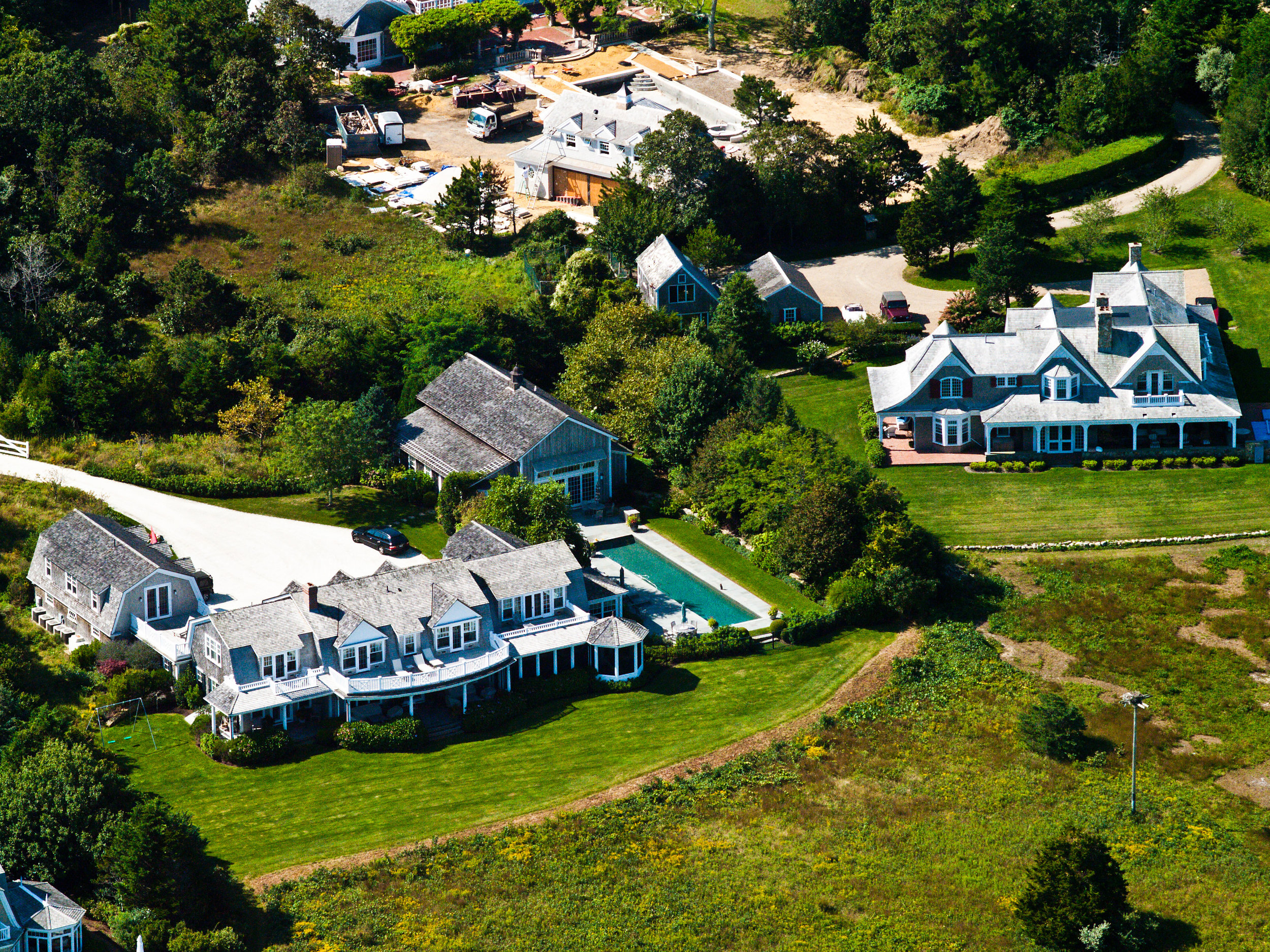 A Martha's Vineyard mansion under construction with neighboring mansions