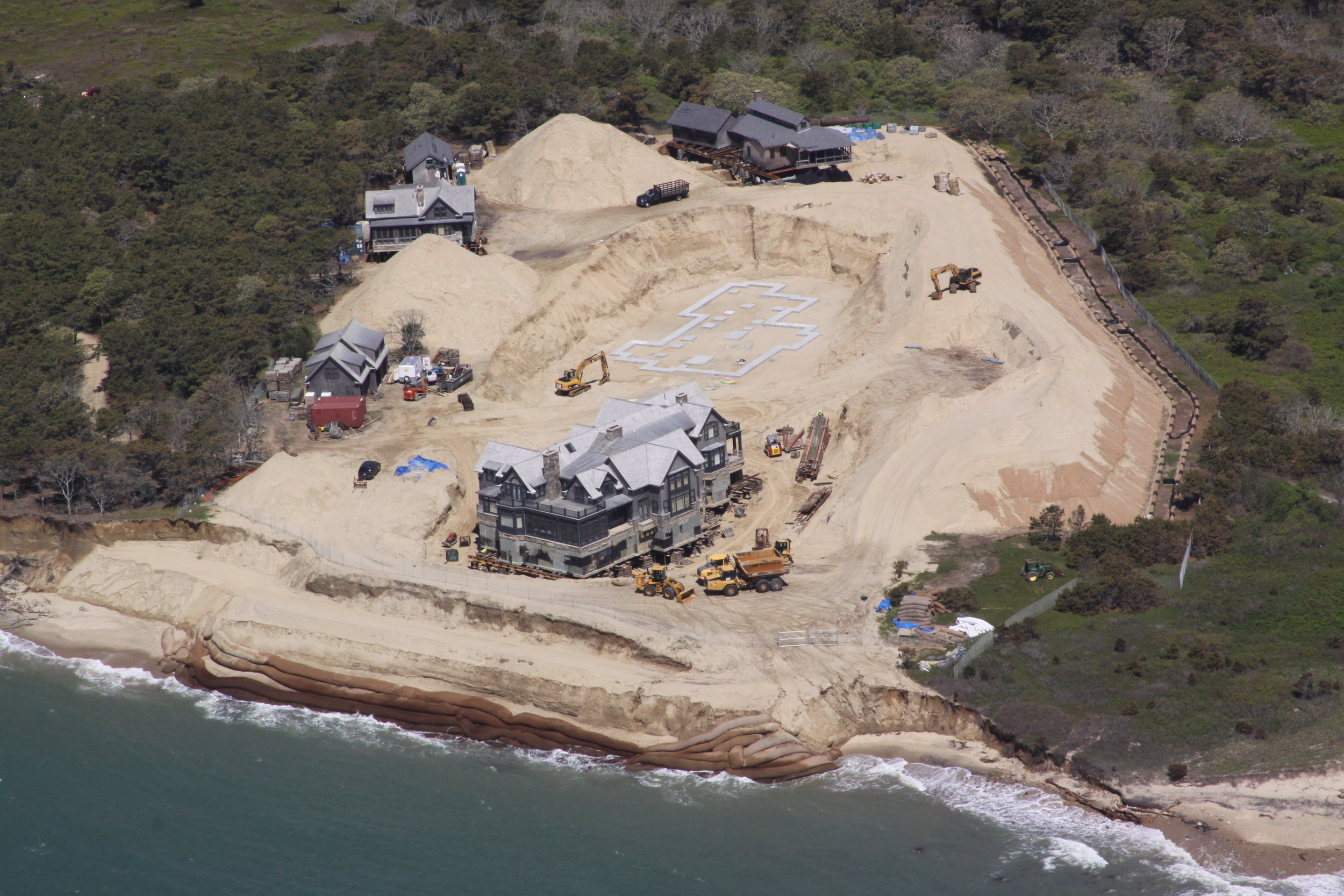 A mansion threatened by coastal erosion being moved to a new location