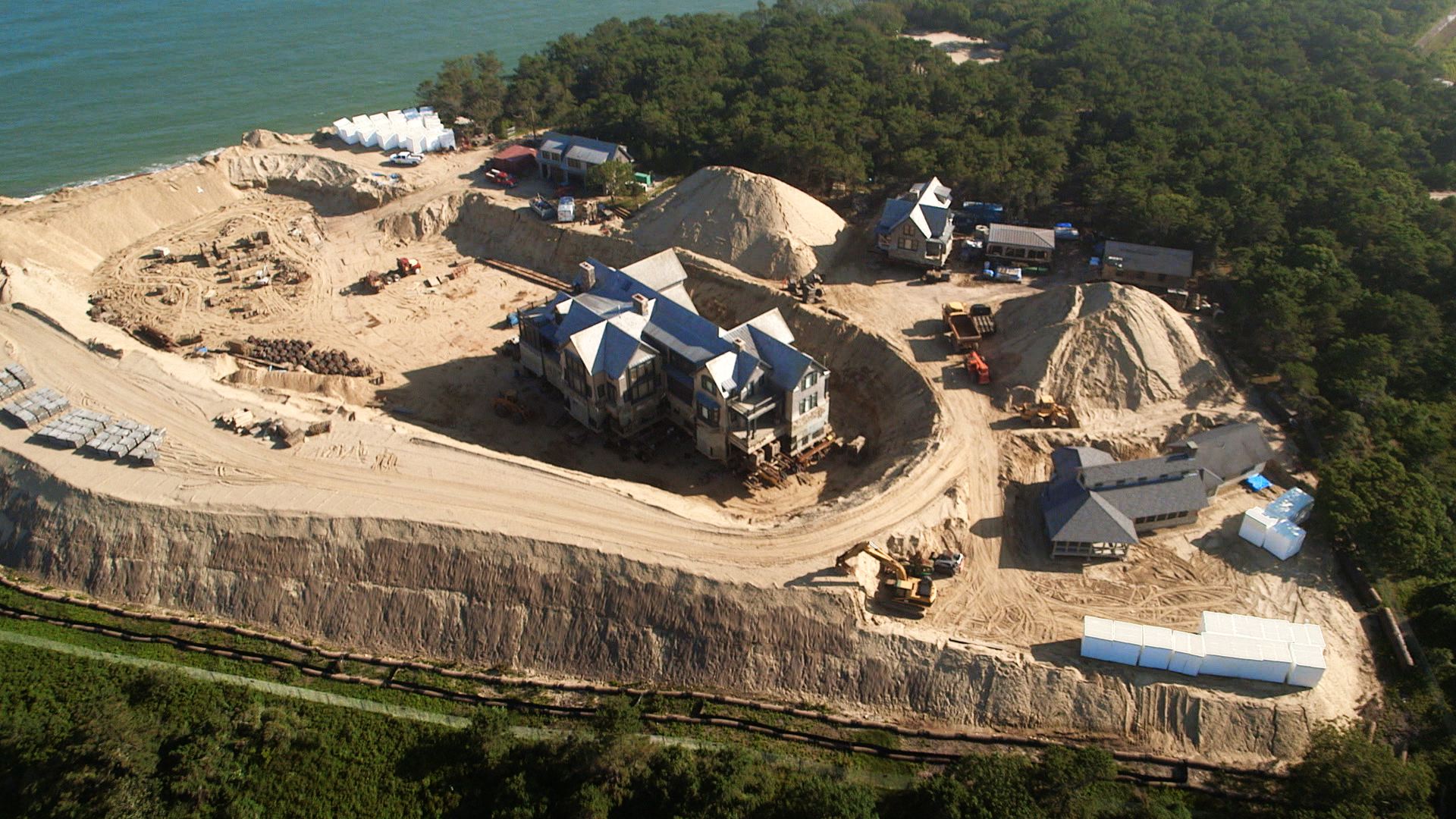 A mansion threatened by coastal erosion being moved to a new location