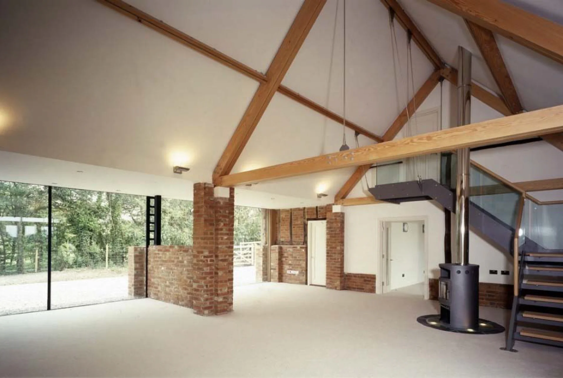 GILL-INTERIOR-PHOTO-LivingSpaceLookingTowardGlazingAndStair.jpg