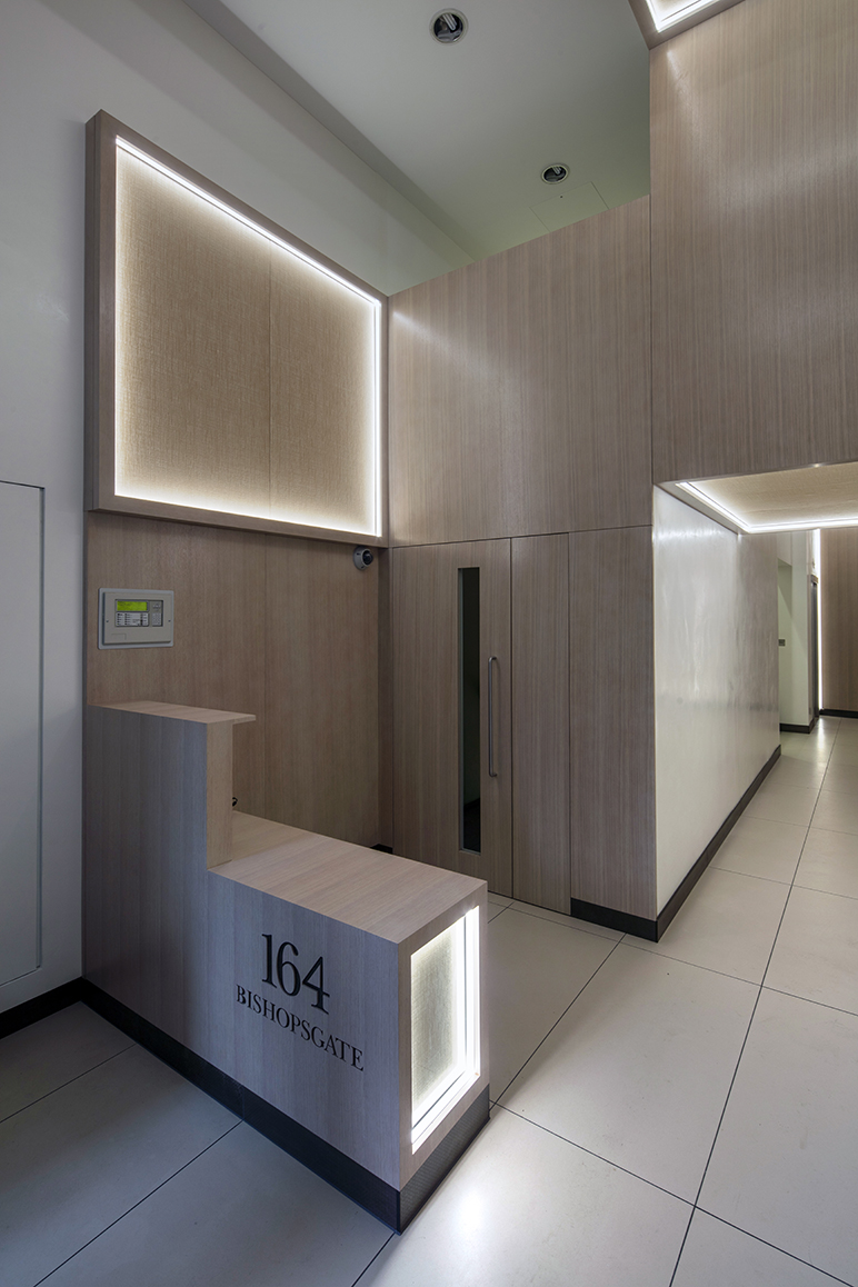 Perimeter illuminated silk acoustic absorbers have been informed by Spitalfields history as a supplier and manufacturer of silk. 