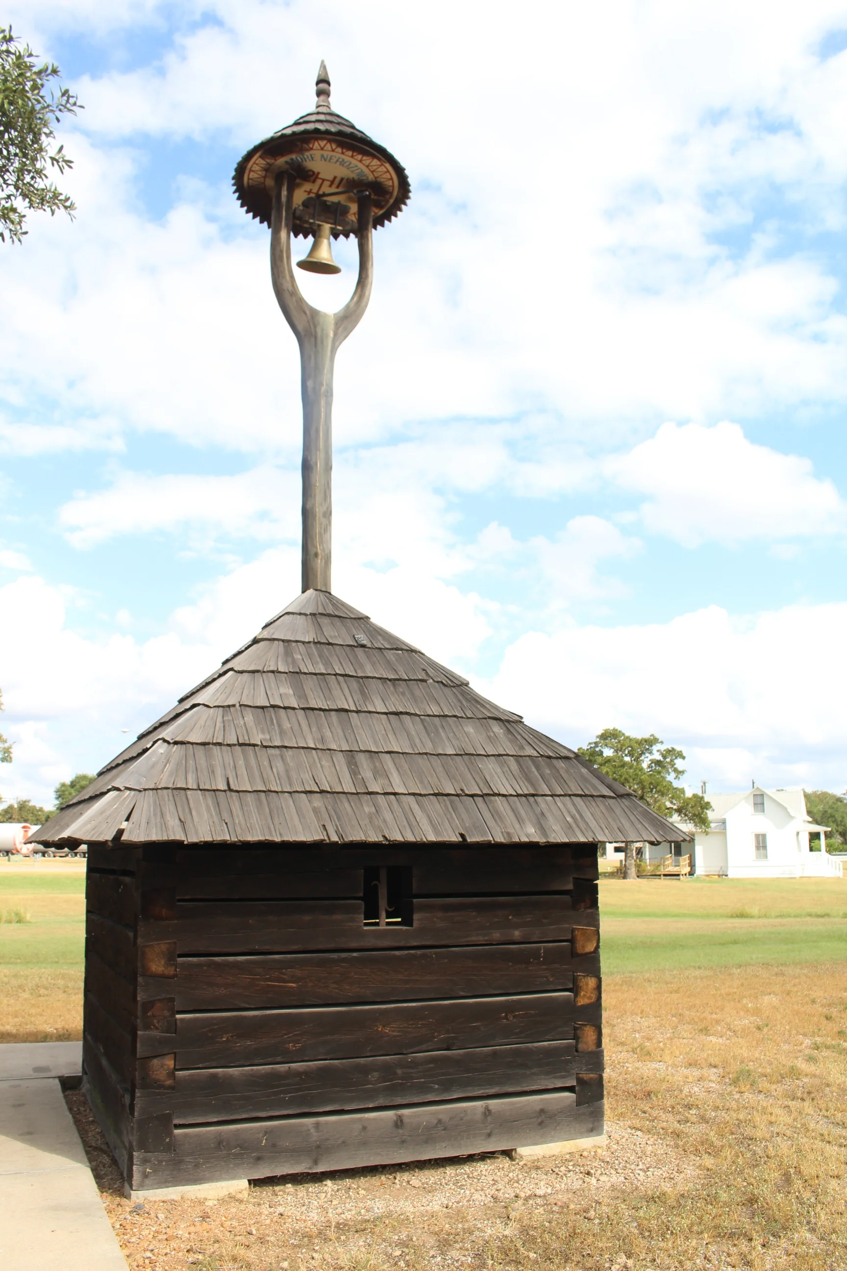 In 1995, the Czech Republic participated in the annual Festival of American Folklife in Washington, D.C. Materials were transported from Roznov, Czech Republic to erect the belfry at the festival site. The bell was cast in Halenkov, Czech Republic especially for this occasion by Josef Tkadlec. The strong friendship between Victor Peter of Houston, a trustee of the Czech Heritage Society of Texas, and Dr. Jaroslav Stika, Director of the Wallachian Open Air Museum in Roznov pod Radhostem, led to the Czech Republic's decision to give the bell and belfry to the heritage society. CHS then donated the belfry to TCHCC, and the belfry was placed on the grounds in 2003. In 2014, the bell was removed from the tower, cleaned, and placed in a showcase in the TCHCC Melnar Library for viewing. A replica bell was then hung in the tower.