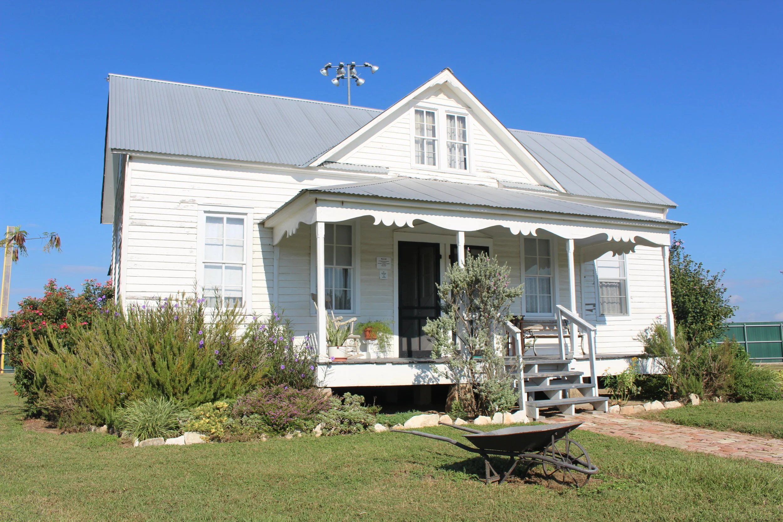 This house was donated and moved to TCHCC by Donald and Betsy Chovanec in 2008. Frank Hluchanek built this house in the Holman area of Fayette County in 1890. In 1915, Frank converted the old combination kitchen-dining room into a dining room and added a new kitchen. He sold the house to Anton and Mary Špaček Salaš in February of 1940. They updated the kitchen and added a bathroom in the enclosed porch. After moving the house to TCHCC, the kitchen and dining room was completely renovated. The added bathroom was torn out and the porch was renovated back to a wash room. The house was furnished and decorated to reflect the lifestyle of a middle class rural Texas-Czech farm family from 1890-1930s. Sladek Smoke and Wash House The Smoke & Wash house was funded by the children of E.A. & Frances Sladek of La Grange. It resembles many of the important out buildings of the time. The Smoke House was a vital part of living. Without electricity for refrigeration, meats were smoked and cured for preservation. The Wash House functioned as a place to wash clothes, wash and can vegetables, and store canned foods along with other important household necessities when houses only consisted of the main rooms.