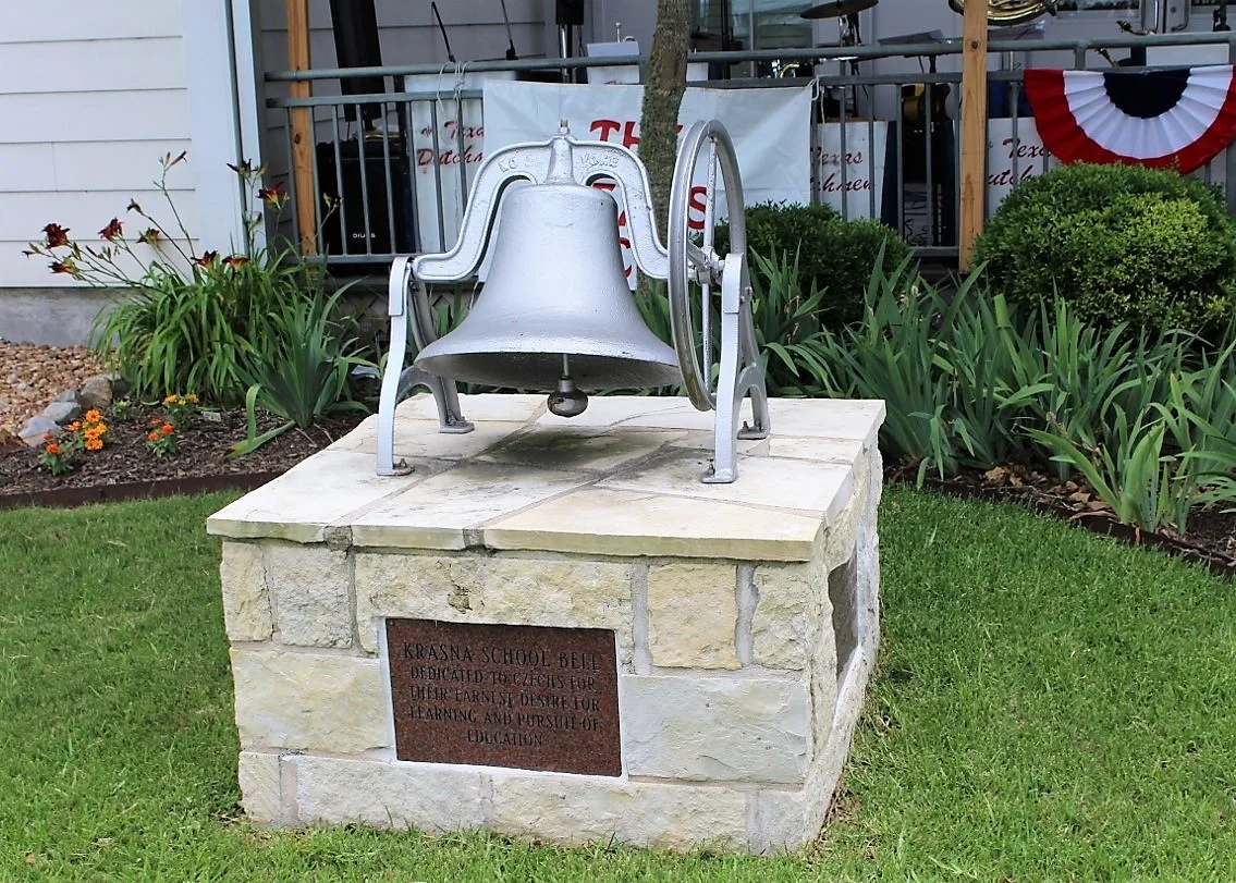 DEDICATED TO CZECHS FOR THEIR EARNEST DESIRE FOR LEARNING AND PURSUIT OF EDUCATION BELL DONATED BY HONORARY CONSUL GENERAL RAYMOND SNOKHOUS AND CLARICE MARIK SNOKHOUS 2014 In 1891, Francis Smith subdivided and sold property in the Wallis area. In 1892, he gave four acres for a school and church for Czech settlers forming the community of Krasna, which means beautiful in the Czech language. That year, local families built a school, and in 1893, it became part of Orchard Common School District. By 1894, it was part of the Krasna District, which included Connersville School for African American students. Two additional schools, Moravia and Central, were later built. Flooding and storms caused a decline of the settlement, and the Catholic Church at nearby Wallis (Austin County) attracted settlers; there was never a church at Krasna. Read more .
