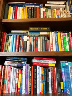 My overflowing bookshelf as of today. Note to self: must reorganize soon.