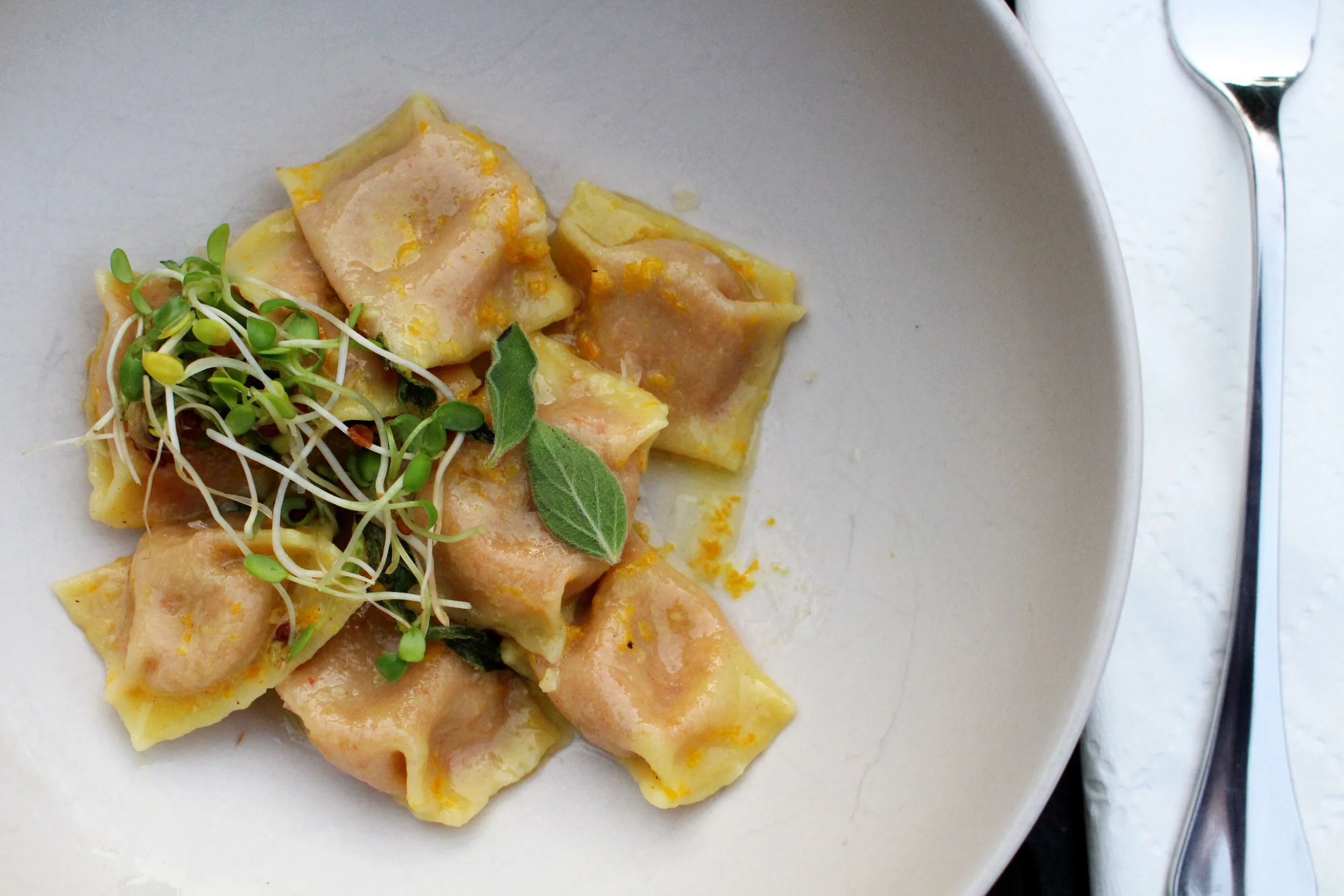 nduja agnolotti, orange, oregano, brown butter