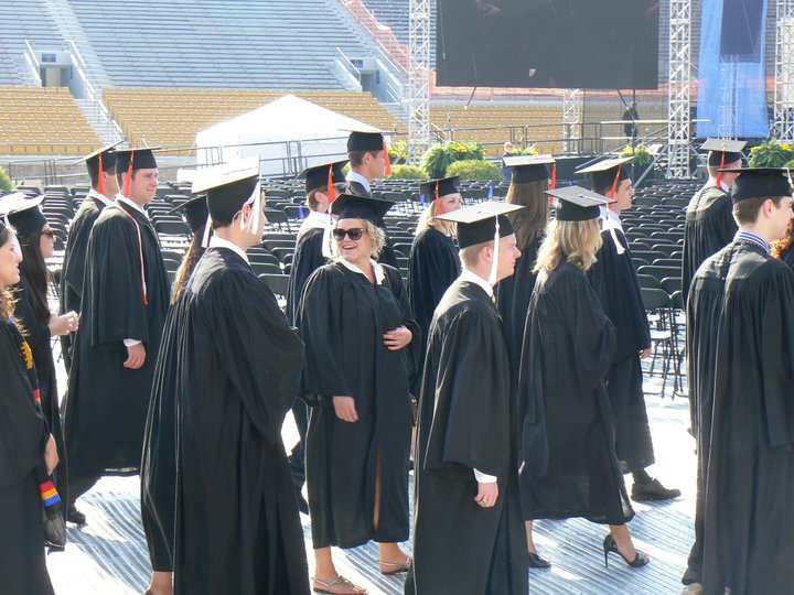 Hayyy. Here I am graduating, which apparently happened five years ago. Slightly drunk. Very tired. Not really following any kind of dress code.
