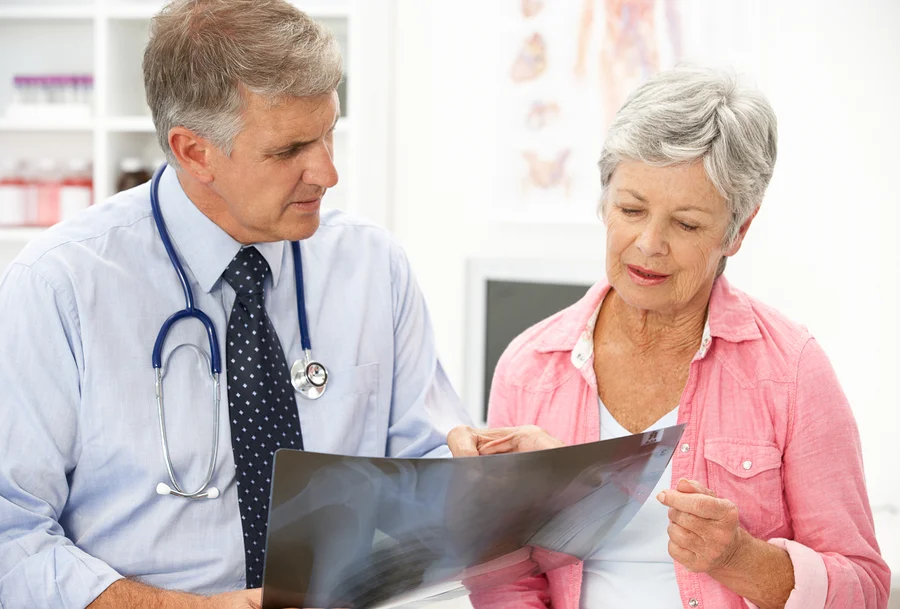 bigstock-Doctor-with-female-patient-21258404.jpg