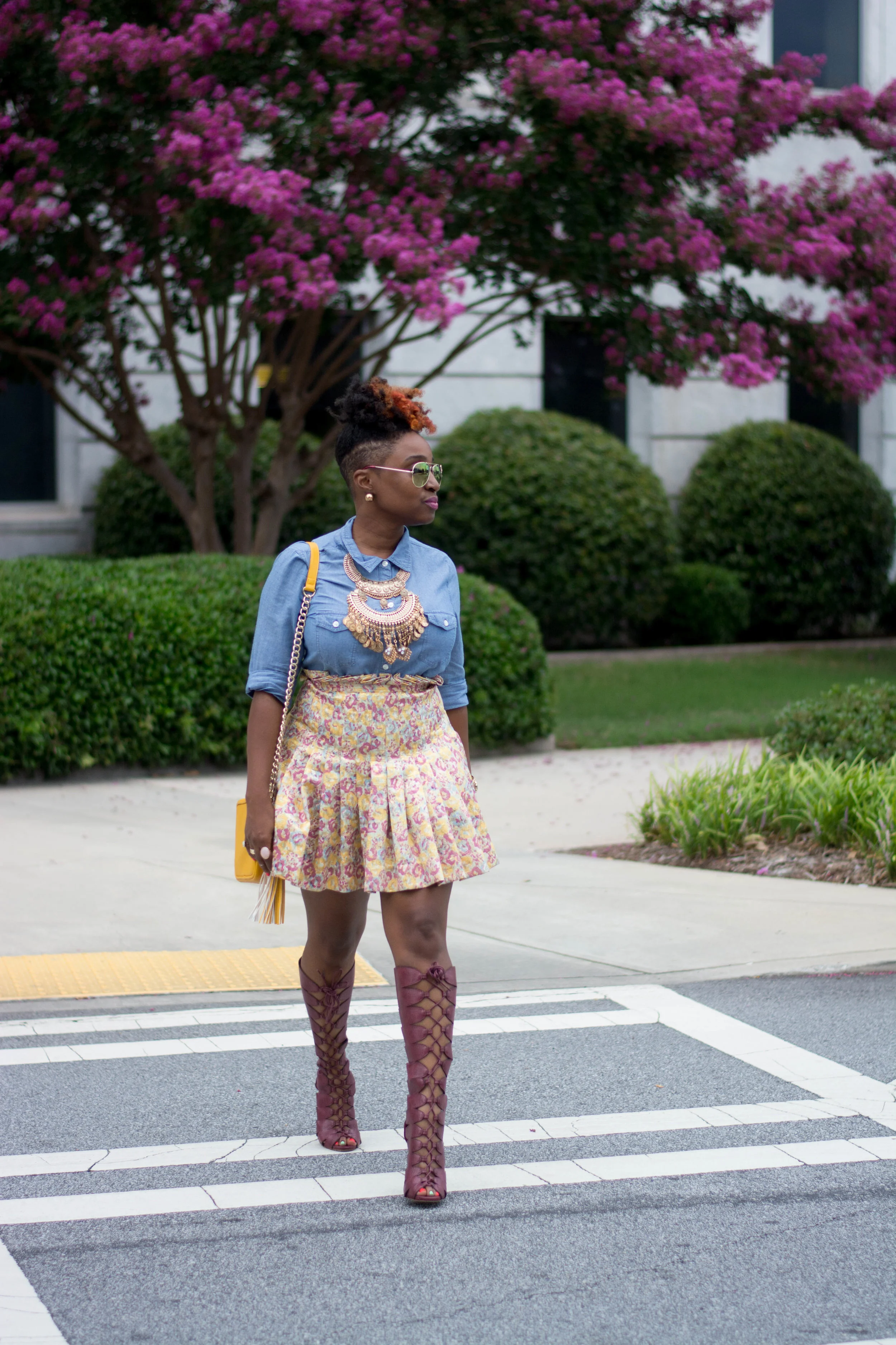 Atlanta style blogger, chambray top and floral mini skirt with tall Bordeaux lace up boots