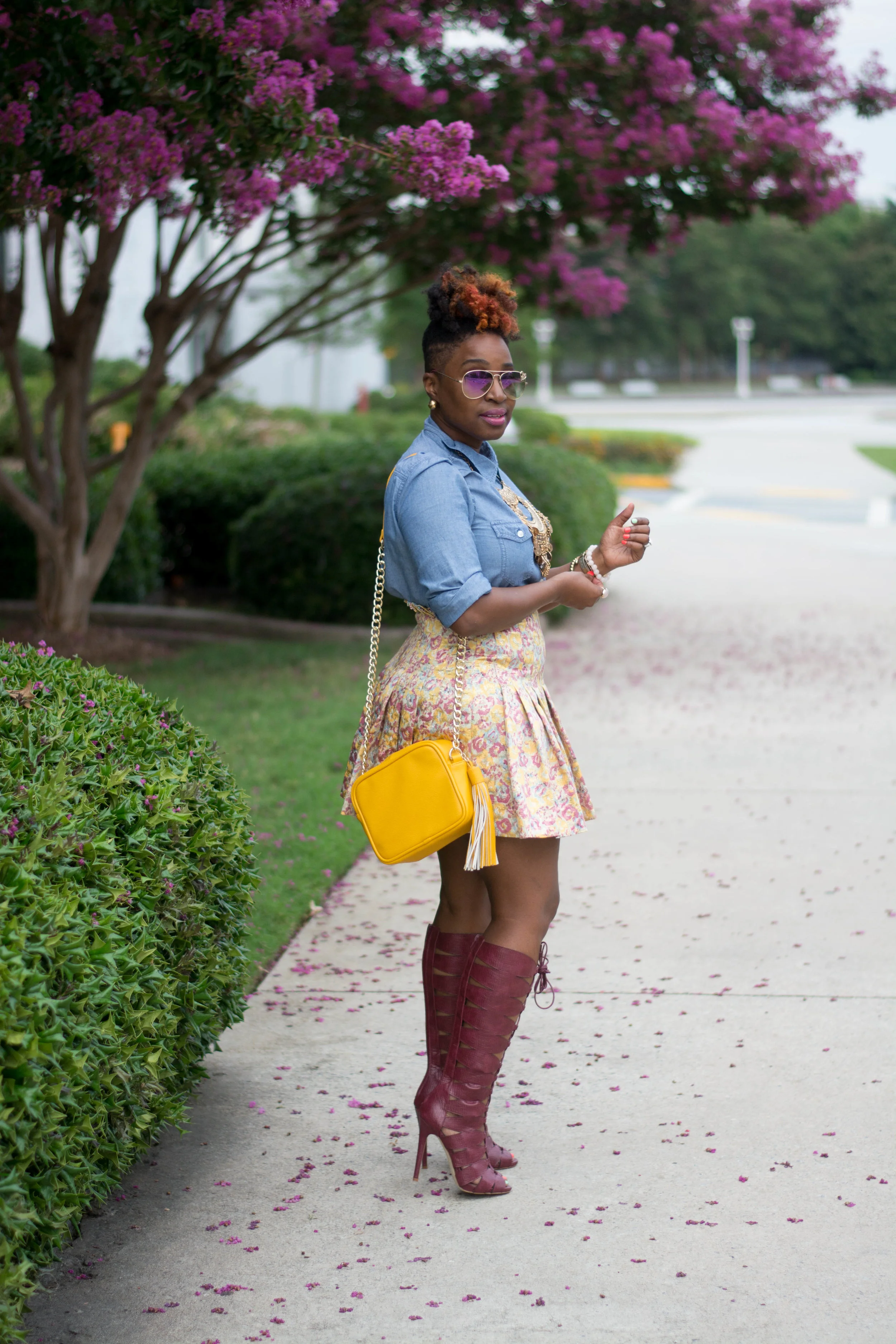 Atlanta style blogger, chambray top and floral mini skirt with tall Bordeaux lace up boots