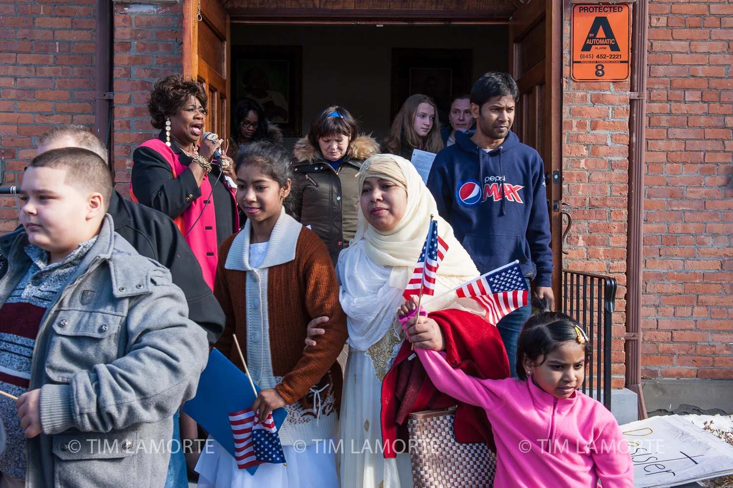 Sharlene Stout sings as marchers exit Springfield Baptist Church on Feb. 16.