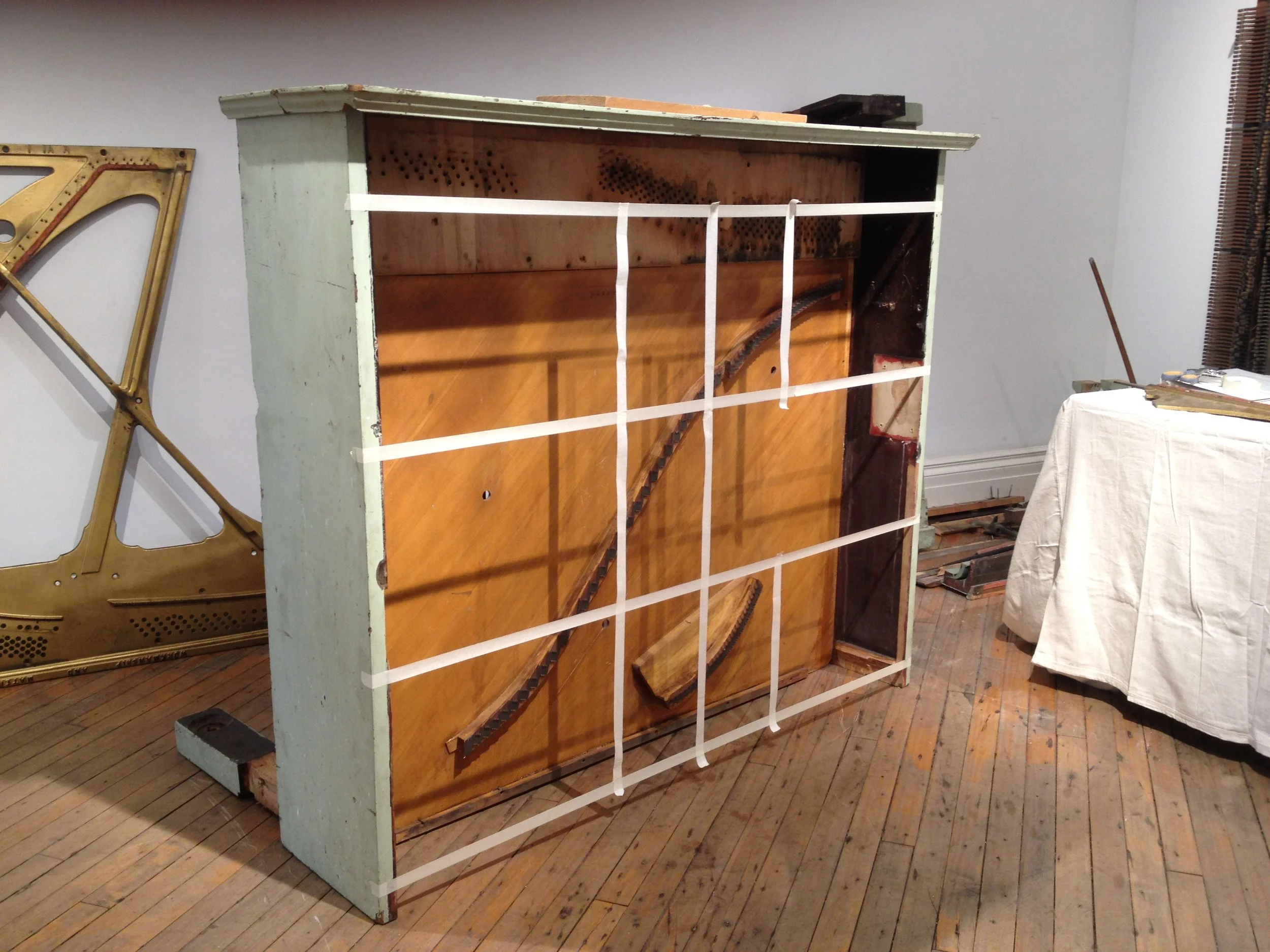 Preliminary markings on the back of the piano indicating the emplacement of the shelving system for the shadow boxes. 