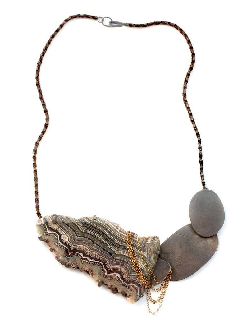 SHIBUMI GALLERY &ndash; TOIL by Karen Gilbert. 
Artist Karen Gilbert&rsquo;s new collection invites a slow look. Found materials, refined metals, worn stones&mdash;each piece in toil holds a kind of tension between the accidental and the precise. Bet
