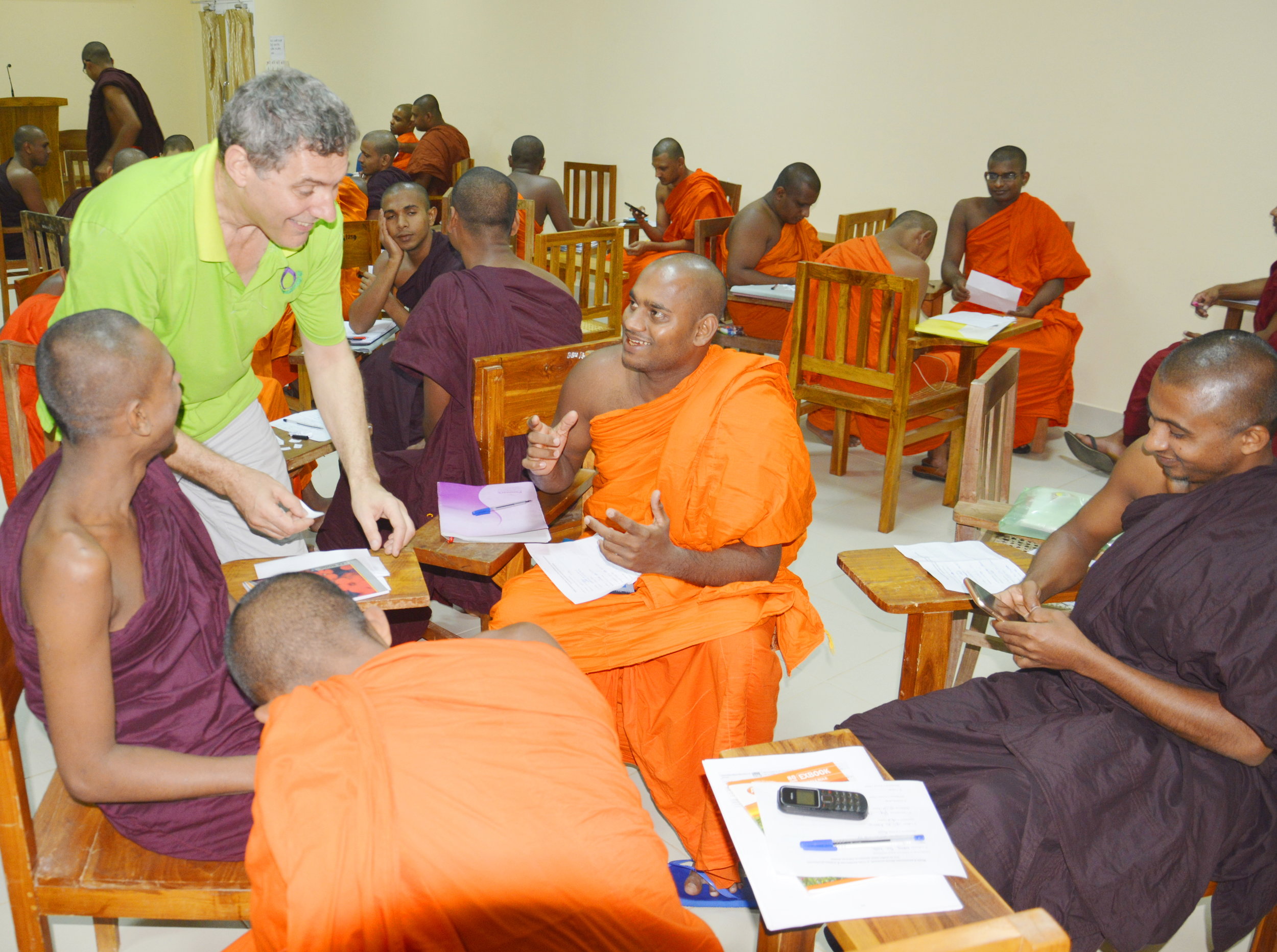 Explaining an English language learning game to monks of the Bhiksu University