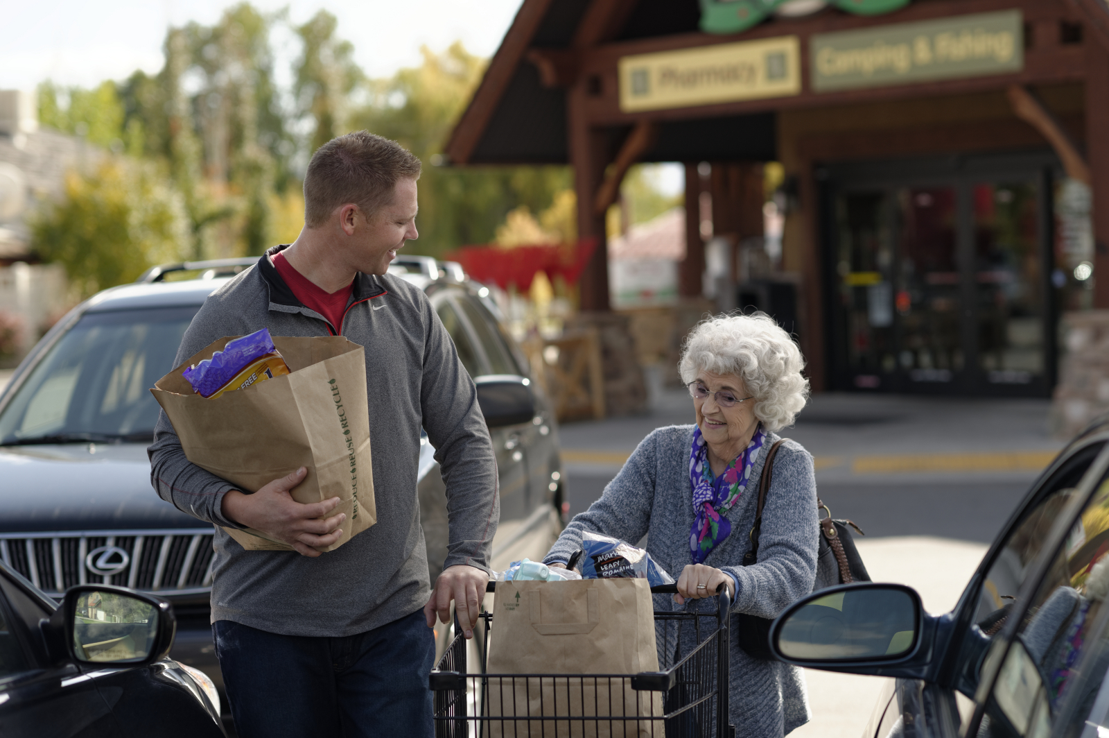 man-helping-elderly-woman-groceries-1176571-print (1).jpg