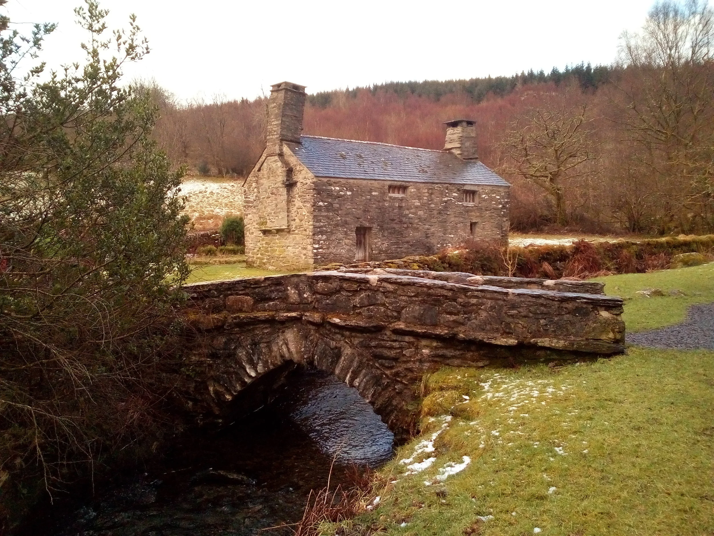 View of the historical farmhouse from the powerhouse.